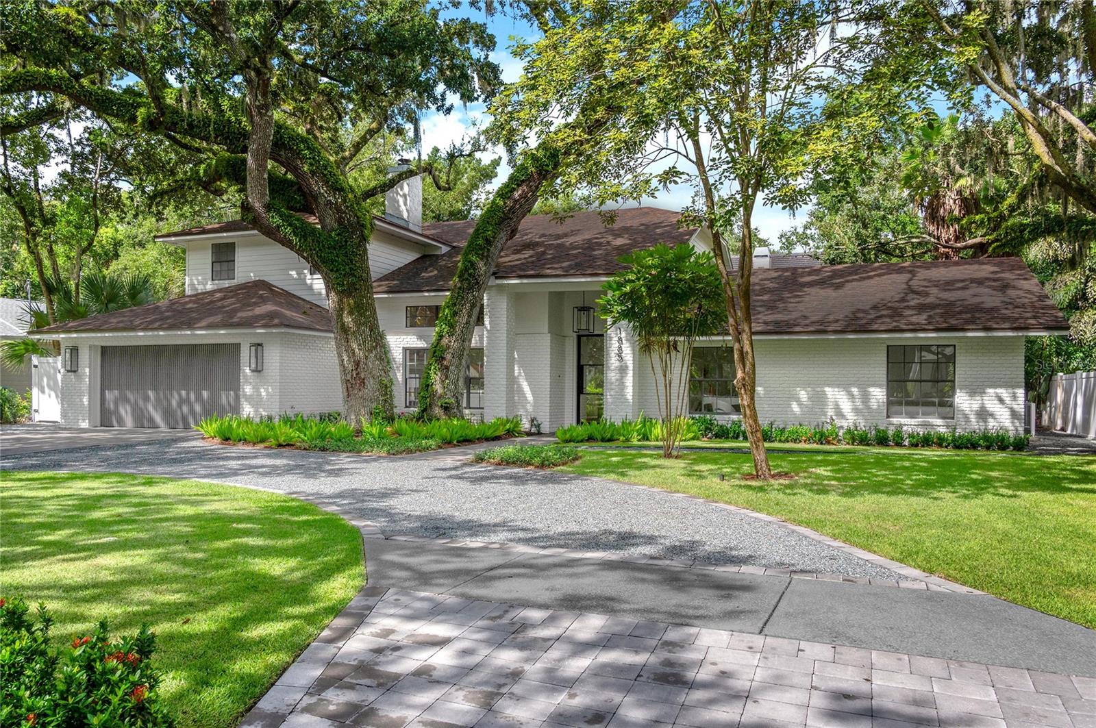 Located in highly desirable Lugano Terrace just steps from the shores of Lake Knowles, this stunning all new interiors, 5-bedroom, 3.5-bath brick home effortlessly blends timeless charm with extensive modern updates. Set on a beautifully oversized landscaped lot with a roundabout driveway. Winter Park’s most sought-after neighborhoods near the Vias, Winter Park Raquet Club and Dommerich Elementary. Inside, wide-plank engineered white pine flooring flows throughout, complementing vaulted ceilings, wood-burning fireplace in the living room, and a spacious open layout ideal for entertaining. The informal dining room overlooks the private backyard and resurfaced PebbleTec pool, while the chef’s kitchen impresses with dual islands, quartz countertops and full-height quartz backsplash, custom hood, Thermador appliances including a 48” six-burner gas range and French door refrigerator.
The gorgeous, light filled family room showcases gas fireplace and a built-in bar with wine fridge.
The expansive upstairs primary suite is a luxurious retreat, featuring a spa-like bath with a dual-entry shower with Infrared sauna, soaking tub, dual vanities with LED mirrors, expanded closets, and a sitting area. Also upstairs is a flexible loft or library space, an office/nursery with a private balcony, and a bonus exercise room or third closet. Three spacious bedrooms are located downstairs, including a second primary or guest suite with its own en suite bath and pool access.
Notable upgrades include a new roof (2021), PEX plumbing and water heater (2025), updated electrical panels, new propane tank, new AC supply grills, and a second AC system (2016). Additional features include Level 4 smooth drywall, custom trim and moldings, 8’ metal front and double back doors, custom wood interior doors, upgraded light switches and plugs, all-new designer light fixtures ( Regina Andrew, Visual Comfort, etc. ), fireplace surrounds, and custom metal and wood staircase. Outside, enjoy a fully fenced and gated backyard with turf and paver landscaping, updated pool coping, and a covered porch ideal for entertaining, new exterior paint and gas lanterns. The 2-car garage includes custom paneled doors, painted floor and workshop area. Located within walking distance to top-rated Dommerich Elementary, Maitland Middle, and Winter Park High, and just minutes from Park Avenue and the Winter Park Racquet Club, this home offers exceptional quality, location, and lifestyle.
Many more details in marketing package.
