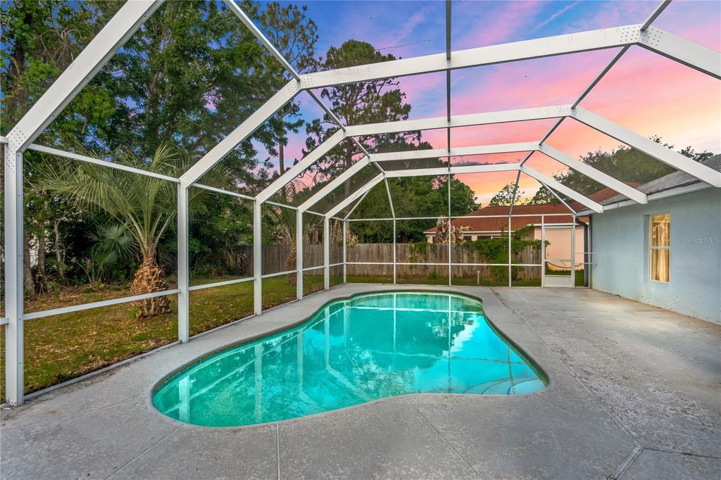 Photo of 85 Sloganeer Trail, Palm Coast, FL 32164 (MLS # FC318167)