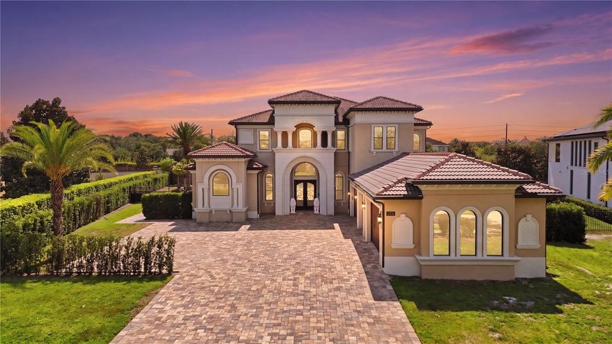 Located in one of Windermere’s most sought-after luxury GATED communities with 24-HOUR SECURITY-SCREENED ENTRY, Casabella, this exceptional custom-enhanced ESTATE showcases ultra-modern design, refined craftsmanship, and elevated INDOOR-OUTDOOR LIVING, offering impressive scale, custom design, and an exceptional lifestyle experience.

Designed with both scale and functionality in mind, the home features an OPEN-CONCEPT floor plan with 7 BEDROOMS, including a beautifully appointed MAIN-LEVEL Primary Suite with a spa-inspired bath, freestanding soaking tub, expansive dual custom-designed walk-in closets, oversized glass-enclosed shower, and integrated STEAM SAUNA. The main floor also includes an additional GUEST SUITE and 2 HALF BATHS.

Upstairs, 5 additional BEDROOMS, 2 FULL BATHROOMS, and a spacious LOFT create a well-designed secondary living retreat, offering flexibility for gathering, relaxation, and elevated everyday living.

The expansive DESIGNER-ENHANCED GOURMET KITCHEN serves as a striking centerpiece of the home, showcasing imported custom cabinetry, architect-inspired detailing, premium JennAir APPLIANCES, and seamless flow into the GREAT ROOM, multiple dining areas, and surrounding living spaces.

Additional interior highlights include a custom-designed EXECUTIVE OFFICE, luxury flooring throughout, ELECTRIC blackout shades, DIGITAL CODE LOCK entry systems on all bedroom doors for added privacy and convenience.

Across all 4 FULL BATHROOMS and 2 HALF BATHS, the home showcases floor-to-ceiling tilework, integrated bidet systems, and refined finishes throughout, while 1 HALF BATH offers direct OUTDOOR ACCESS, adding convenience for the POOL and surrounding outdoor living spaces.

Designed for both relaxation and everyday enjoyment, the outdoor living experience features a HEATED SALTWATER POOL, SPA, SUMMER KITCHEN, FENCED BACKYARD, and mature PRIVACY LANDSCAPING.

Set on approximately 0.63 ACRES, the property also includes a 5-CAR GARAGE with EPOXY FLOORING and AIR-CONDITIONED garage space, an estate-style driveway with exceptional space for car enthusiasts and guests, TESLA CHARGER, FULLY PAID SOLAR PANELS, WATER SOFTENER SYSTEM, and a WHOLE-HOUSE GENERATOR.

With proximity to premier GOLF COURSES, scenic LAKES including the Butler Chain of Lakes, top-rated public and private schools, shopping, hospitals, and major roadways, plus convenient access to Disney and Orlando’s premier attractions, Casabella offers privacy, security, and elevated luxury living in one of Windermere’s most desirable communities.