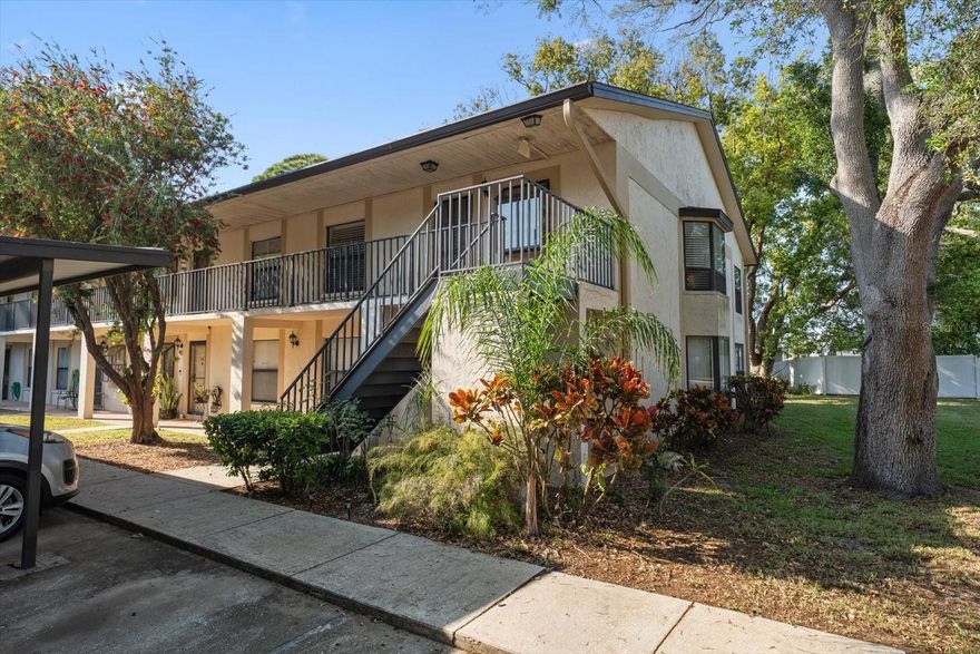 Experience the perfect blend of modern comfort and natural beauty in this meticulously maintained second-floor corner unit. Located in the established community of Deerwood Gardens, this light-filled residence offers a unique "nature-in" feel. This home offers a beautiful bay window in the dining area and a lovely sunroom, both providing serene views of the mature wooded greenery. The open-concept layout feels incredibly expansive thanks to soaring vaulted ceilings and is perfectly paired with durable luxury vinyl flooring throughout. At the heart of the home, a beautifully updated kitchen features a convenient breakfast bar that overlooks the main living area, creating a bright and connected atmosphere for entertaining friends and loved ones. 

The smart split-bedroom floor plan ensures total privacy, featuring a spacious owner’s suite with a private en-suite bath and a generous walk-in closet. For added convenience, your dedicated interior laundry area is tucked away near the guest wing. This pet-friendly, all-ages community offers a wealth of amenities, including a pool, clubhouse, tennis, and shuffleboard. While the setting feels secluded and quiet amongst the trees and nature, you are just minutes from the shopping, dining, and movies at Seminole City Center, as well as the sprawling trails of Walsingham Park and Lake Seminole Park. This move-in-ready gem is exceptionally well-priced for a quick sale—don’t miss your chance at the ultimate Seminole retreat! New HVAC and garbage disposal! No flood insurance required