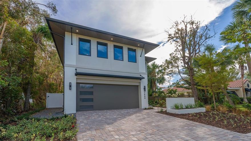 Recently Completed and Move in Ready! - 1944 Grove Street brings modern style and luxury to another excellent West of the Trail location. Majestik Homes defines the best of Sarasota's work and play lifestyle. Located just minutes from downtown, top ranked Siesta Beach and walking distance to Southside Elementary, this 4 bedroom 3.5 full bathroom modern home is loaded with luxury finishes, hurricane impact windows and hurricane ready construction.. Built by Majestik Homes and Designed by Award winning DSDG Architects. Enter the front door into a jaw dropping open concept floorplan, with polished concrete floors sparkling against the backdrop of a lush landscaping. The massive resort style pool and spa with sheer descent waterfalls and ample sun shelf make the perfect retreat. The show-stopping gourmet kitchen boasts Stainless Steel appliances, modern cabinets and a 5-person waterfall edge island. Step out through the sliding doors of your Master bedroom on to your second story balcony to enjoy balmy evenings or watch the fun in the pool. Modern Style and generous spaces leave nothing to be desired at 1944 Grove Street.
