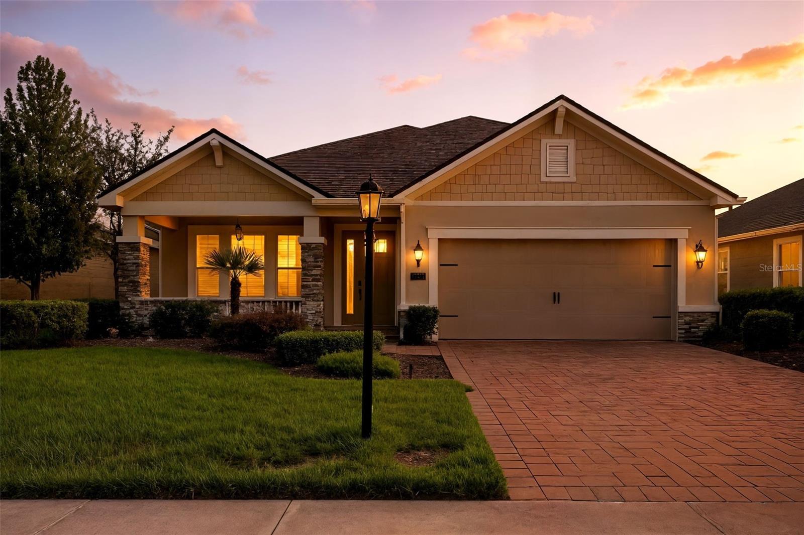 One or more photo(s) has been virtually staged. PARADISE FOUND IN HARMONY! This former Mattamy model home is packed with upgrades and stylish details. Take in stunning lake views from the extended paver patio featuring a pergola, outdoor kitchen, and built-in firepit. The Everglade floor plan has every add-on a showcase home should have, including 3 bedrooms, 2 baths, and a den on the main level, plus a 4th bedroom, bath, loft, and spacious hidden "Florida attic" storage closet upstairs—ideal for those seeking private living areas. Highlights include beautiful wood plank ceramic tile floors, hardwood in the den and Master Suite, custom built-ins in the den, espresso cabinetry, granite countertops, newer stainless steel appliances, elegant tile accents, abundant recessed lighting, 8' interior doors, 5 1/4" baseboards, crown molding, tray ceiling in the Master, built-in cabinets in the Master Bath and utility room, updated light fixtures and ceiling fans, plus a new roof! Enjoy maintenance-free lawn care and access to fantastic community amenities like a pool, fitness center, and playground. The Community Center is a stones throw away! Experience premier Lakewood Ranch living with easy access to shopping, dining, top-rated schools, I-75, UTC Mall, and downtown Lakewood Ranch, Sarasota, and Bradenton. Plus, you’re just a short drive from award-winning Bright sand beaches including Lido Key, Siesta Beach, Longboat Key, and Anna Maria Island! Room Feature: Linen Closet in Bath (Primary Bedroom). Schedule your showing today!