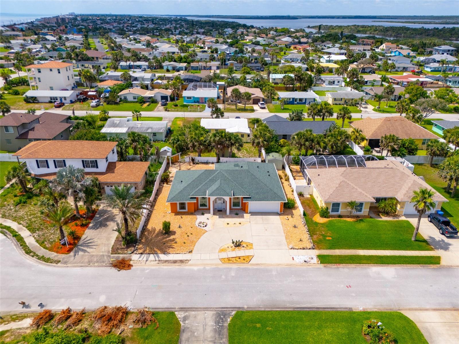 One or more photo(s) has been virtually staged. Live the Beach lifestyle! This beautiful three bedroom block home features an office that could be a fourth bedroom, two full bathrooms, two car garage, shed and large backyard. The house is nestled on a peaceful cul-de-sac in the highly desired neighborhood of Pelican Dunes. Freshly painted, high ceilings, open floor plan, split bedrooms, large walk in closet in primary suite, plenty of storage throughout and all tile floors just perfect for beach life! Enjoy outside living with a glass enclosed patio, circular driveway with tons of parking, tropical plants and trees and a quick jaunt to the beach or the river.
Enjoy the refreshing beachside breezes every day from this lovely piece of paradise! This rental will feel like home! Pets are allowed and all lawn care and trash removal are taken care of by the landlord. Thirty day minimum rentals are allowed in this area of the county. Perfectly nested between Ormond Beach and Flagler Beach which offers every fun coastal restaurant and shop that you can imagine. Surf in the morning, walk the dog on Flagler Beach or at the dog park close by and ride your golf cart to dinner! It’s a beautiful life!