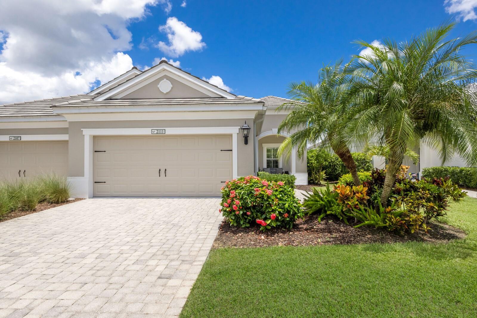 Welcome to this beautifully maintained, move-in ready villa in the gated, resort style community of Eagle Trace in Lakewood Ranch. With NO CDD FEES and in Flood Zone X where flood insurance is not required, this is Florida living made easy.
Begin your morning with coffee on the charming front porch, feeling the soft breeze as the neighborhood wakes up arround you. Step inside to a warm, inviting interior with plantation shutters, crown-molding coffered ceilings, and natural light that dances across the professionally cleaned ceramic tile floors. The heart of the home is the kitchen, where a spacious island invites friends and family to gather. You'll appreciate the upgraded wood cabinetry with rollout shelves, GE Pewter Profile Series natural gas appliances and undercabinet LED Lighting.
The open floor plan flows effortlessly into the extended, enclosed lanai, a perfect retreat to enjoy sunsets year-round. With roll-up sunshades, peaceful lake views and lush landscaping, you'll find it easy to relax and soak in the Florida lifestyle. The villas thoughtful floor plan offers two spacious bedrooms and a versitle den that can transform into your private office, reading nook or guest space. The primary suite is your personal haven, complete with a custom walk-in closet system and an en-suite bath featurning double sinks and a tiled walk-in shower. A well appointed guest bedroom and bath ensure comfort for your visitors, while the laundry room with storage cabinets and included NEW WASHER & DRYER adds convenience to your daily routine.
The two-car garage features a painted floor, adjustable shelving, utility sink and holds the storm shutters for peace of mind during every season. Step outside and the community becomes an extension of your lifestyle. Eagle Trace offers a resort-style pool and spa, tennis and pickleball courts, a playground, two dog parks, and scenic walking trails. With a tile roof and thoughtful upgrades throughout, this villa is more than a home-it is your chance to embrace the Lakewood Ranch lifestyle and A Rated Schools.
Located just a short drive to Siesta Key Beach, UTC Mall, St Armand Circle, Ringling Museum, Longobat Key, Anna Maria Island, Sarasota Bradenton International Airport and Downtown Sarasota.