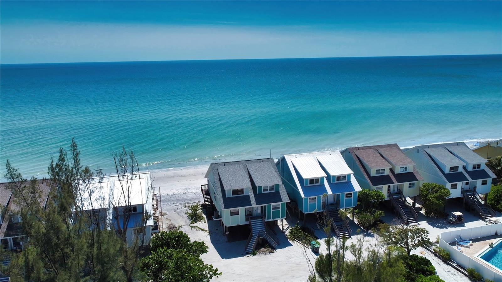 Direct beach front home! The tranquility of island life and the feeling of sand between your toes are part of living on a wide, silky sand Barefoot Beach. The structure is in excellent move-in condition, but more importantly, it is located seaward of all other structures capturing twenty miles of unobstructed beach views from Boca Grande to Manasota Key. Move-in or lease this income-producing property today!! No public beach access adding to your enjoyment, Bring your boat, Airbnb INCOME with this BEACHFRONT TOWNHOME ON DON PEDRO ISLAND with SOARING VIEWS OF THE GULF OF MEXICO ALONG WITH BOAT ACCESS Across the street. Toes in the sand from your back porch and 7 miles of pristine beaches to stroll looking for seashells, sharks teeth & incredible sunsets. Enjoy a few nights yourself and rent out the rest of the year. This 2 bedroom, 2 ½ bath townhome offers new updates throughout including solid wood cabinets, granite counters in the kitchen, hardwood floors in the main living areas and fresh tile at the entryway and into the kitchen. From the upstairs master suite, you’ll appreciate the private balcony offering exclusive sunset showings. The “Colony of Don Pedro”association offers a community pool, tennis court & dockage making this unit ideal for potential investment. Whether the beachgoer, fisherman, or just looking for an island escape…Dolphins, manatees, and sea turtles are frequent visitors, and star gazing is exceptional. You will see shooting stars every night. Let sea breezes sweep your cares away while the sound of waves relax you sleep. Sea turtles build their nests outside, and baby sea turtles hatch before your very eyes. Pelicans soar past your windows while Sea Turns search for nourishment at the water's edge. You are engaged with "Nature at it's Finest". The Benefits of walking out your door directly onto silky sand, collecting seashells, swimming in warm turquoise blue water, and toasting the end of a perfect day as the setting sun paints the sky with vibrant colors are Never Ending! Palm Island is a true, bridgeless, barrier island surrounded by water with a distinct feel of living in the Bahamas. But you are only 800 feet off Florida's West Coast and still in the USA. The island has all essential services including city water, on island Countyl Fire Department with EMS, county police, weekly garbage collection, high speed internet and T.V., restaurant, gift shop, ice cream/sandwich shop, and open space. Grocery stores, Walmart, and Home Depot are one to five miles away. What the island doesn't have are high rise condos, crowded beaches, congested streets, or crime. Why? Palm Island is the last bridgeless barrier island serviced by two large car ferries which operate every ten minutes from the mainland. Travel time to the island is four minutes. The benefits of a car ferry are that it creates a unique type of "gated" community. There is no place like Palm & Don Pedro island to help you unwind and reconnect with nature in one of the most beautiful settings on earth.