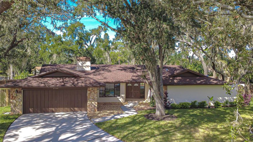 Step into a beautifully updated pool home set on a quiet cul-de-sac in the desirable Lithia Oaks community, featuring 4 bedrooms, 3 baths, and a private pool perfect for indoor/outdoor Florida living. Recent updates include a new water heater and AC unit, fresh interior and exterior paint (2025), and all-new flooring and ceiling fans throughout. Natural light fills the home, highlighting the spacious open layout and warm finishes. The formal living and dining areas create an inviting setting for entertaining, with picturesque views of the backyard and pool. Multiple sliding glass doors throughout the home open to the lanai, creating a true indoor/outdoor living experience that’s perfect for Florida living. At the heart of the home, the remodeled kitchen is a showstopper—featuring a stunning waterfall island, new stainless appliances, quartz countertops, and modern cabinetry. The kitchen flows effortlessly into the family room, where a wood-burning fireplace adds warmth and charm. The split bedroom floor plan provides comfort and privacy for everyone. The primary suite is spacious and serene, offering a huge walk-in closet, a beautifully updated en-suite bath, a private fenced patio, and direct access to the pool. A secondary bedroom nearby features its own full bath, ideal for guests or a home office. Two additional bedrooms on the opposite side of the home share a stylishly remodeled bathroom. Step outside to your private oasis—complete with a screened-in pool, covered lanai, and a rare oversized fenced yard framed by mature oak trees. It’s the perfect backdrop for gatherings, play, or simply relaxing in the shade. You’ll also love the ample storage space throughout the home and the convenience of a laundry room with a utility sink and easy access to the two-car garage. This home truly checks all the boxes—modern updates, flexible spaces, incredible storage, and a yard that’s hard to find in this area. Close to highly rated schools, NO CDD and low HOA fees! Lithia Oaks is a lovely neighborhood with no through traffic, shaded by grandfather oaks, close to shopping and dining options. Don’t miss the opportunity to make it yours!