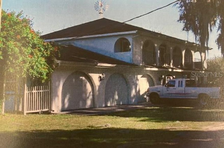 YOU FOUND IT!  HUGE OPPORTUNITY to build your FAMILY COMPOUND! 4-bedroom, 2 1/2 bath single-family home situated on 20+ acres!  The home has passed a 4-point inspection. The primary bedroom is huge with a nice bath, a jacuzzi tub, and a separate shower, a 10x20 screened covered porch off the master looking over the pasture and pond, the additional (3) Bedrooms have French doors leading to a huge, continuous, covered porch that runs the entire front of the house. Downstairs is a half bath, perfect for guests. Pecky cypress, gorgeous wood-walled brick floor, family room. Eat in the kitchen area. Open-concept dining room and living room, BEAUTIFUL brick fireplace. Inside access to a 3-car attached garage. Covered porch off the dining room. Laundry room off the kitchen. Enjoy your time outside in your screened lanai or host a huge party and cookout on your expansive acreage. Bring your cows, horses, goats, chickens, and ducks! Horse boarding is available! BONUS EQUIPMENT: (19) 12x12 Stalls, Concrete center aisle, Fly spray system, Hot cold wash rack, Covered open porch, Feed room, Tack room with Bathroom. 10-acre pasture w/ 1 acre natural pond (drinkable horse water), (4) individual pastures (approx. 1 acre each). THE GRASS IS AWESOME with Water lines, 80 ft solid round pen (steel base of a grain silo). HUGE 80 x 80 Metal/Shop building. 

Also features TWO MOBILE HOMES: 3 Beds | 3 Bath single wide, with a fenced yard, separate driveway from main house. Very private: a 3bdr 3bthrm double-wide, very well kept. Currently, both mobile homes are tenant-occupied (great-paying tenants). The well, septic, and drainfield have been updated for each home on the premises. The value is in the land! Best of all, you are only minutes away from major shopping areas and interstates, making it easy to get wherever you need to go! For more info see MLS#TB8472229