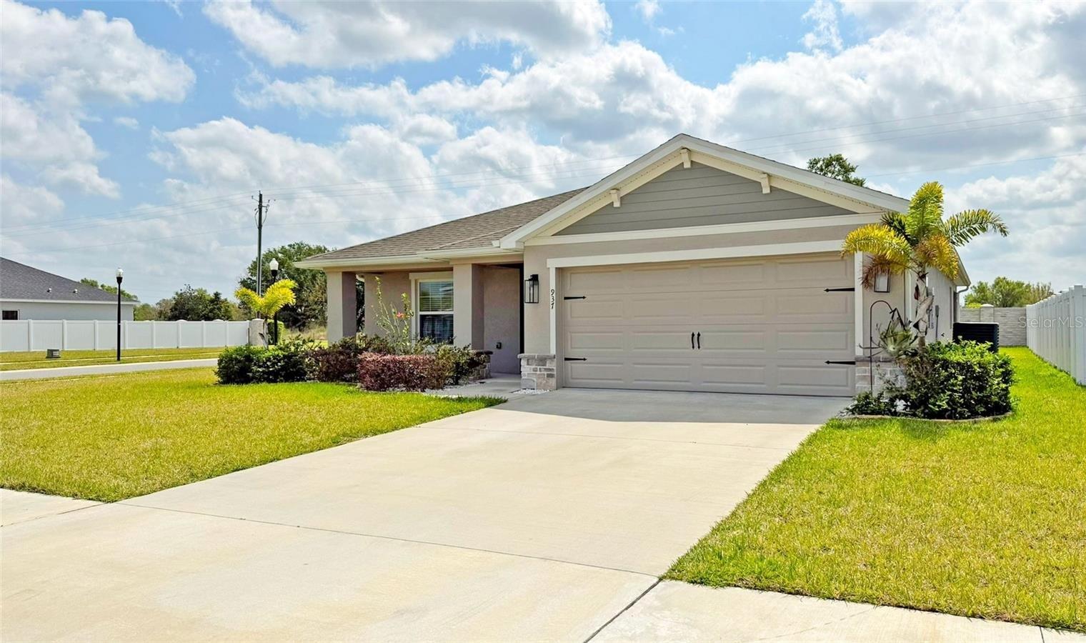 Location, Location, only 30 min from Walt Disney World Parks, 8 min from I4. "Amazing 2022 build property", 4-bedrooms, 2-bath, over size corner lot. NO carpet, beautiful Luxury plank vinyl flooring throughout the house including all four bedrooms, included wood blinds in all windows. Cover and screened Lanai. Doble Garage. Auburn Cove community has two dog parks and direct access to the TECO scenic walking trail that offers 6.5-mile for a perfect outdoor pure nature exercise and relaxation! The spacious kitchen with its large island and open floor plan with vaulted ceilings, offers the perfect space for family gatherings for memories that will last for ever. Property Includes: Water softener for the entire home, Gutters, Whole-house solar panel system, installed in 2022, designed to help reduce energy costs while supporting a greener lifestyle, this system generates surplus clean energy meaning that TECO buys back the excess electricity, and the property owner receives normally a credit back. The system is also powerful enough to support future energy needs—so if you decide to add a pool, it could likely be powered with little to no additional cost thanks to the surplus energy. Solar panels will be pay-off on closing date by the Sellers.