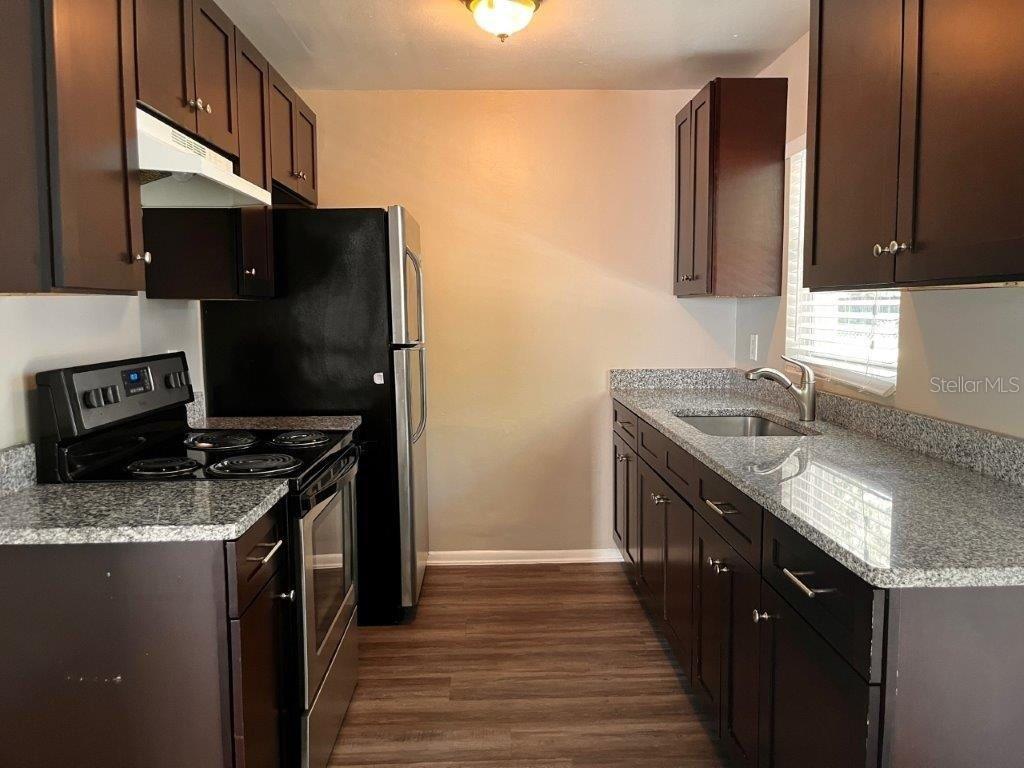 Photo of 1412 Sunridge Road, Orlando, FL 32808 (MLS # O6446196)