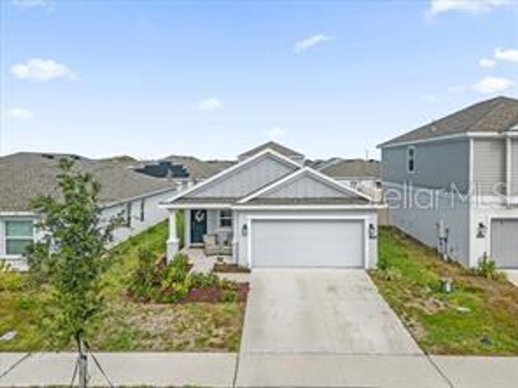 Photo of 509 Sea Turtle Lane, Haines City, FL 33844 (MLS # O6394149)