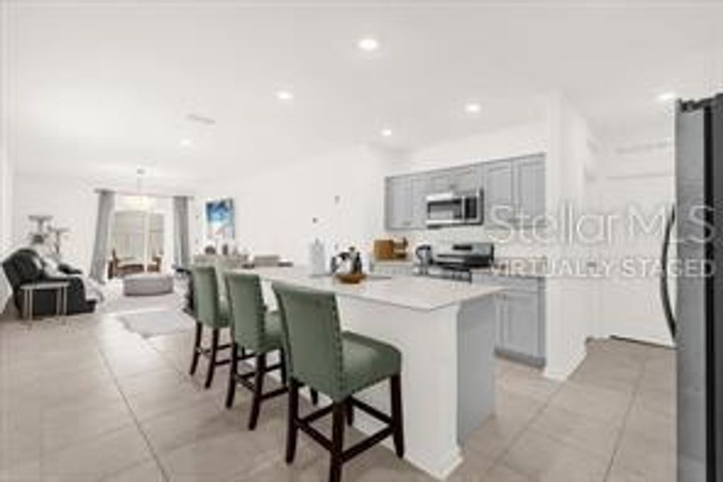 Photo of 509 Sea Turtle Lane, Haines City, FL 33844 (MLS # O6394149)