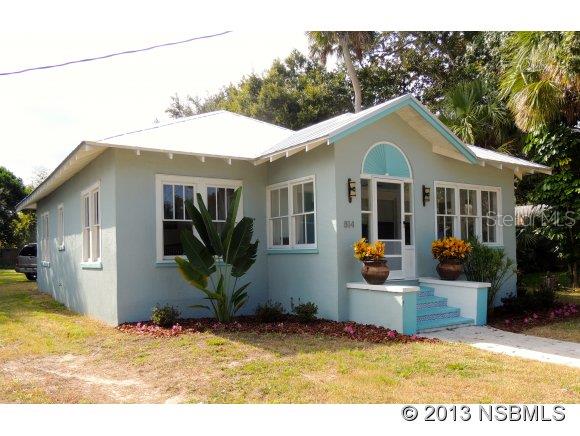 New Smyrna Beach Charm can be yours! This home has been lovingly restored from top to bottom with no detail overlooked, the many modern conveniences blend right in with the old world feel. From the moment you enter the antique entry door and see the original heart pine floors, original built-in cabinets surrounding the fireplace, the 9 foot ceilings with crown molding, you won't want to leave. The large dining room offers great space for entertaining, the living room is comfortable with plenty of light, the kitchen has all new stainless appliances, cabinets and tile flooring. There are essentially 2 master bedrooms, each with en suite baths that have been beautifully redone. There are so many upgrades - new metal roof, new heat and AC system , new plumbing , new 200 amp underground electric service, new kitchen and more. Please inquire about the attached list of detailed improvements too long to list here. Everything has been done for you down to the smallest detail. The backyard can accommodate an RV, boat trailer(s) or any assortment of toys you may have with easy access from the ally as well. Enjoy living in this great location close to Canal Street, Riverside Drive and the beach. ;Water: City