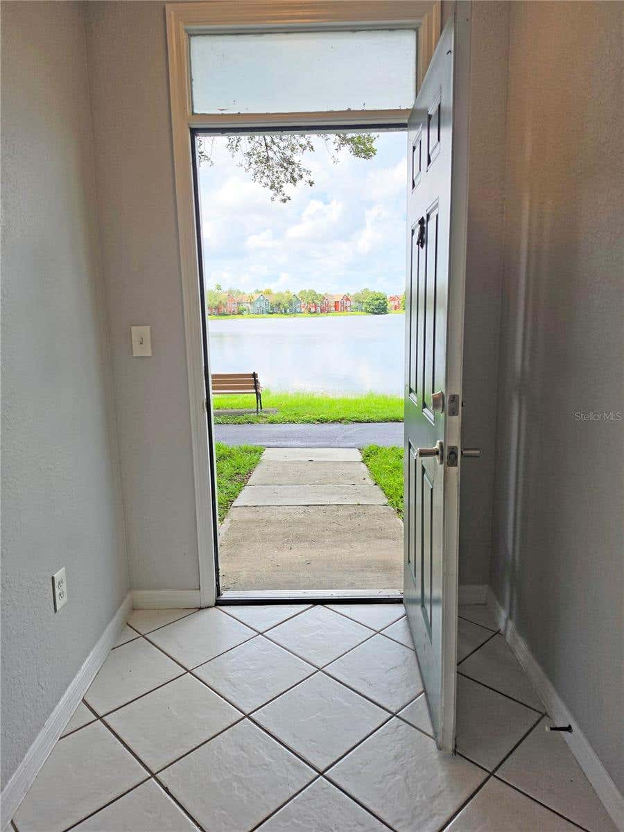 Photo of 9018 Lake Chase Island Way #9018, Tampa, FL 33626 (MLS # TB8536710)