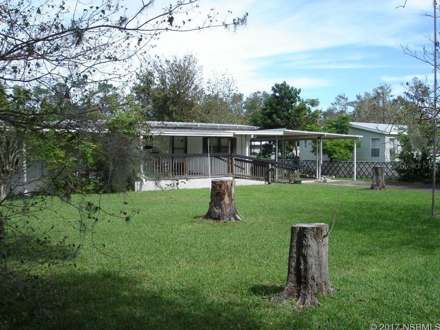 Snowbirds, Bikers and Sportsmen take notice. Set on a large lot in a quiet neighborhood, this could be just the thing you've been looking for.It consists of a 2 bedroom, 1.5 bath single wide mobile home with an addition of 306 sq. ft. for more living space. Needs updating. Two block outbuildings. One is 540 sq. ft. the other is 750 sq. ft. and a 96 sq. ft. storage shed.At one time the smaller block building was used as an efficiency apartment. It has a full bath,  kitchen and a living/sleeping area. The larger block building was used for family gatherings and social meetings. It has two large rooms separated by a wall with a door to access both sides. Both rooms are 28x12. Think of what you could do with the space.The shed is solid; wood framed with T1-11 siding, power, light and a window.Close to everything; shopping, restaurants, the river, the beach and I-95.Weekend getaway, winter retreat or year round living, there's a lot of potential here. ;Water: City