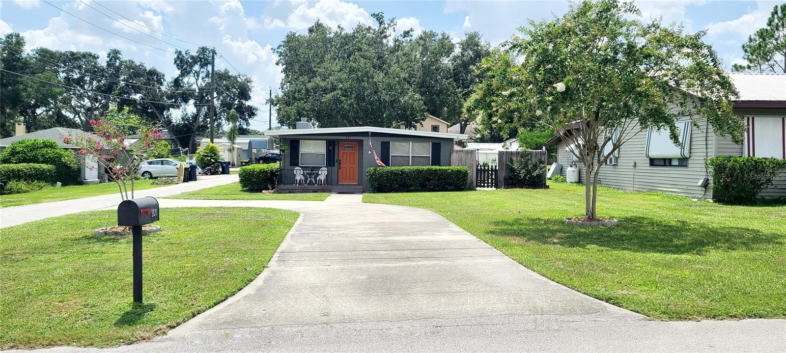 Step into this beautiful 3/1 home located in Auburndale. This stunning corner lot is situated one block to Lake Ariana, providing your family a sanctuary to call home. New A/C Aug 2024, Roof installed 2020. Fireplace in the Primary Bedroom for your enjoyment on a cool night. Step out to the courtyard area, perfect for morning coffee or a nice alfresco dinner. Upon entering the house, you will notice the care and love the seller has put into this house making it a home. The home boasts an open floor plan with beautiful tile flooring throughout the home while two of the bedrooms have carpet. The kitchen is open and large with eat in area.
