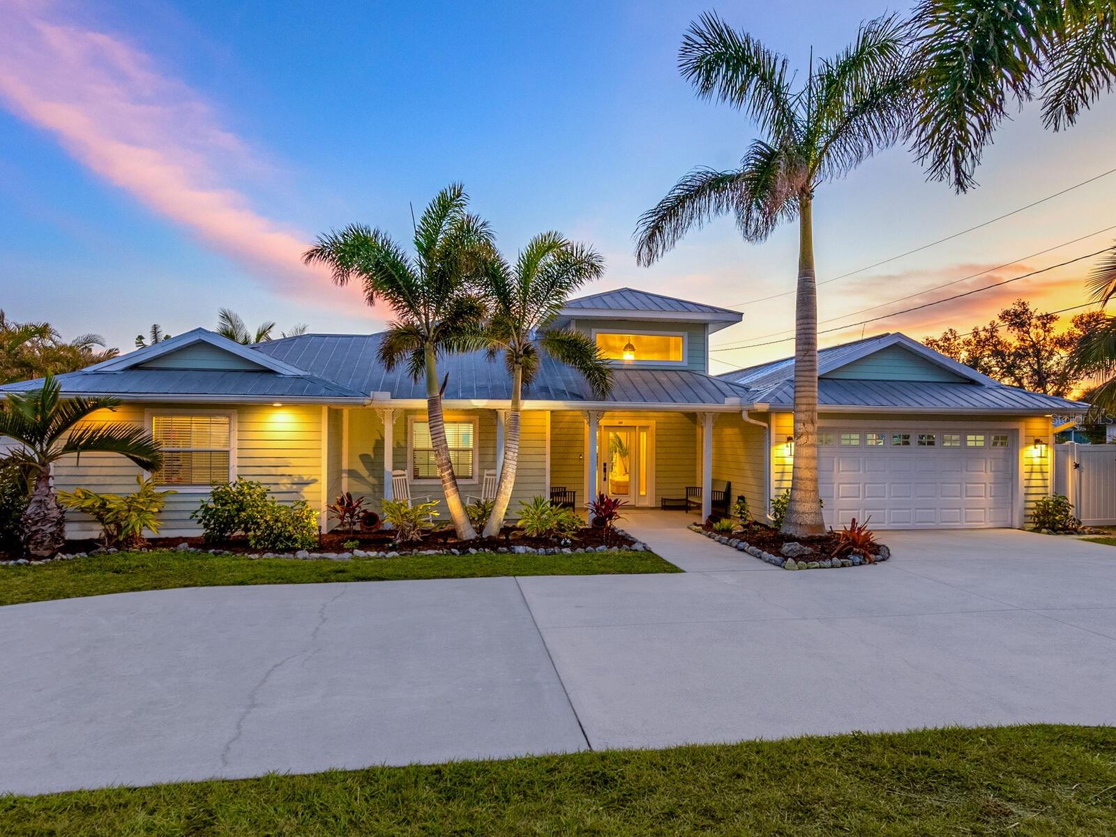 Gorgeous private deepwater canal-front home with a rare double slip boathouse and seawall. You’ll be thrilled when you enter this spacious home that offers five bedrooms, 3.5 baths plus a separate bonus/game room for a total of 4,166 square feet under air and sits on over half an acre lot. This home has been extensively remodeled, replumbed and re-piped. All has been done for you. Enjoy outdoor living with an inviting gazebo, expansive deck along with a beautiful, heated saltwater lap pool. Loaded with closets everywhere and extra storage in the oversized garage. The fenced yard is great for pets, and the wide circular drive offers plenty of parking for a boat or R/V. The boater will appreciate quick access to the open water from the deep sailboat water canal with no bridges. The home is minutes from shopping and beaches. A one-year homeowner warranty will be provided to buyers at closing. Visit and you will not believe your eyes!