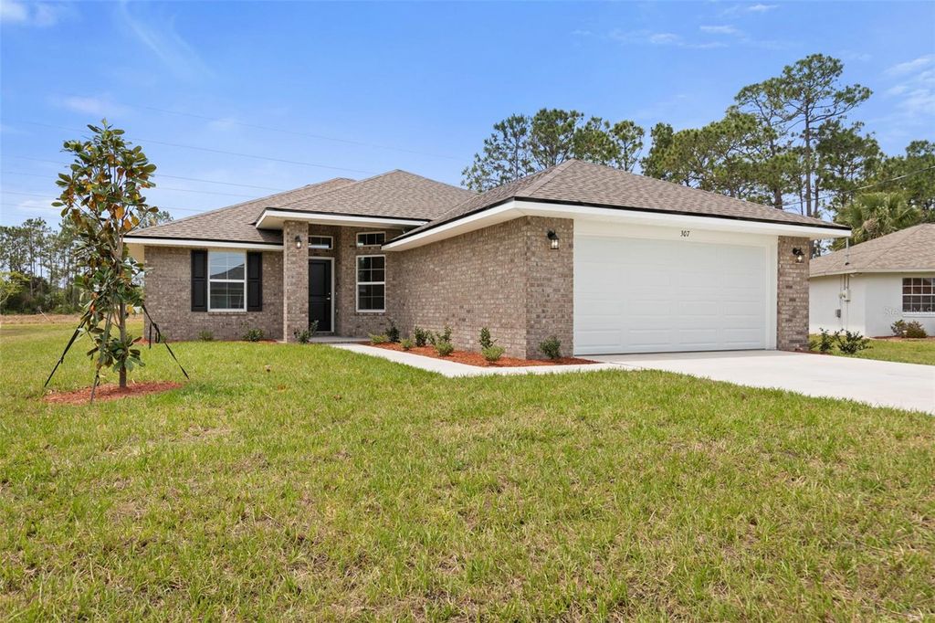 Photo of 47 Brunswick Ln, Palm Coast, FL 32164 (MLS # FC315830)