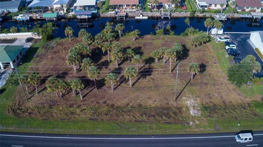 SELLER SAYS BRING ALL REASONABLE OFFERS! READY TO SELL! SELLER HAS OTHER INTERESTS. PRICE REDUCED $76,000.PRICED TO SELL AT $649,000. THIS IS A GREAT PROPERTY FOR A RESTAURANT WITH ALL THE CONSTRUCTION HAPPENING ON BURNT STORE ROAD SOUTH AND JONES LOOP ROAD NORTH TO FREEWAY 75.  NOW PRICED AT $17.34 SQ. FT. Total square feet: 38,332.  See the survey.
This WATERFRONT PROPERTY consists of 250 feet of COMMERCIAL FRONTAGE with a continuously increasing vehicle count on Tamiami Trail. Approximately 30,000 vehicles daily. This property is situated within the Punta Gorda commercial area with easy access to Punta Gorda Airport.
The Township of Punta Gorda has approved the property connection to the existing lift station.
New home developments, approximately 20,000 homes on Burnt Store Road, and surrounding neighborhoods are in process.
Near Walmart Super Center, ALDI Supermarket, Home Depot, and Publix Supermarket. City water, sewer, and electricity are available.  This property is in an excellent location for retail businesses, permitting documents are required through Charlotte County, not Punta Gorda City.
The Township of Punta Gorda has approved the property connection to the existing lift station.
New home developments, approximately 20,000 homes on Burnt Store Road, and surrounding neighborhoods are in process.
Near Walmart Super Center, ALDI Supermarket, Home Depot, and Publix Supermarket. City water, sewer, and electricity are available.  This property is in an excellent location for retail businesses, permitting documents are required through Charlotte County, not Punta Gorda City.