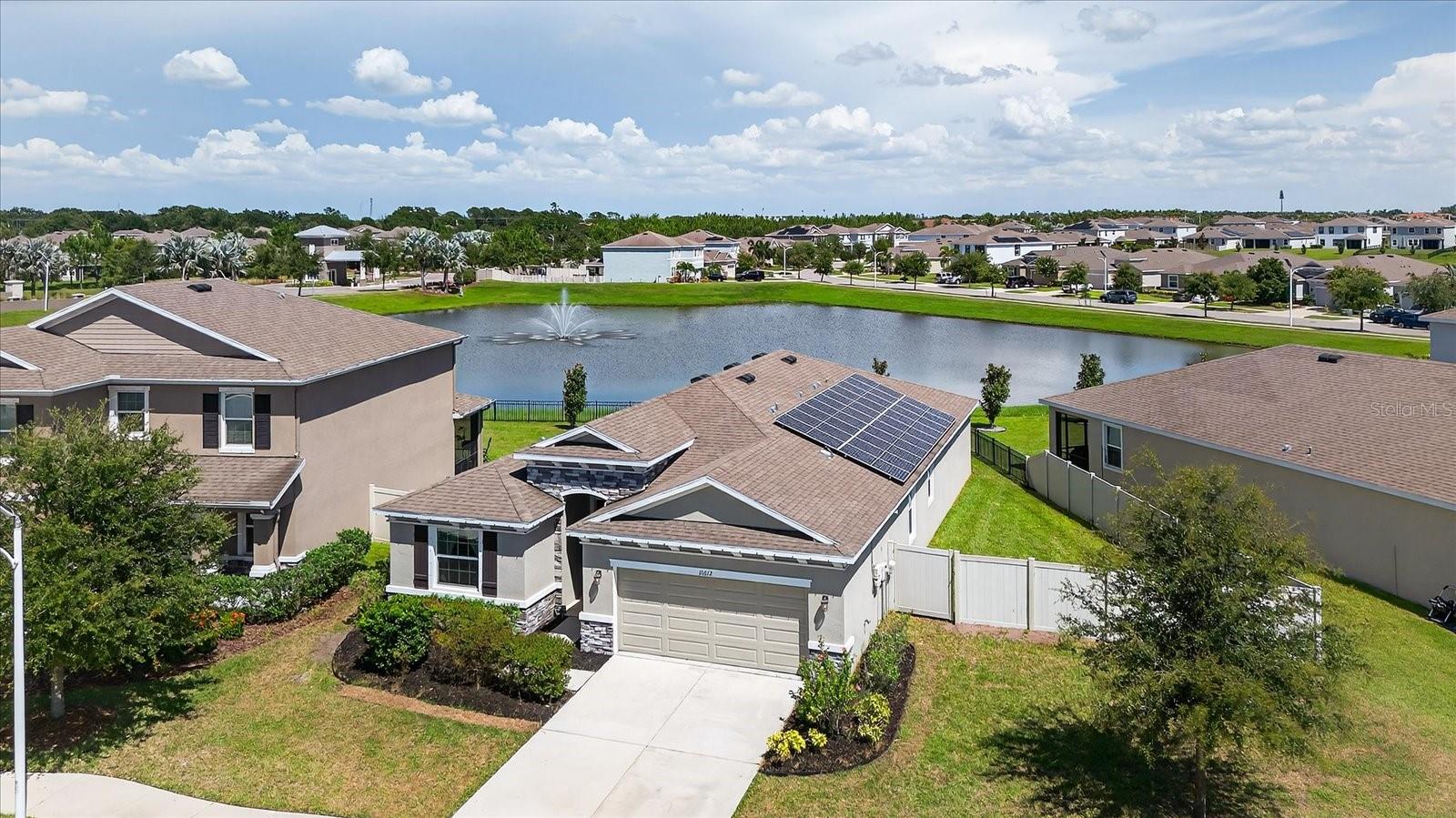 Better than new! This beautifully upgraded 4-bedroom, 2-bathroom smart home offers 2,035 sq ft of open living space, located on a quiet cul-de-sac with pond and fountain views. Built in 2020, the home features a flex room, updated lighting and ceiling fans, upgraded faucets, and a KitchenAid refrigerator. The spacious screened-in lanai includes custom lighting, overlooking a fully fenced backyard. Enjoy incredibly low utility costs with fully owned solar panels (average electric bill ~$25/month) and a whole-house water filtration and softener system for added comfort. Located in a guard-gated, resort-style community with a stunning crystal lagoon, white-sand beaches, paddleboarding, water slides, swim-up bar, clubhouse, dog parks, volleyball courts, and nature trails. Active residents will love the neighborhood’s Facebook community page and year-round events. HOA includes ultra-fast fiber internet, cable, and 24/7 security.
Minutes to I-75, shopping, dining, Tampa, St. Pete, MacDill AFB, and top-rated schools. This home has it all—prime location, modern upgrades, and access to one of the most unique communities in the area!