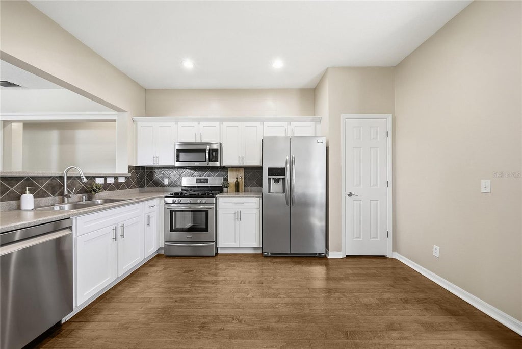 Photo of 2306 Spring Hollow Loop, Wesley Chapel, FL 33544 (MLS # TB8548337)