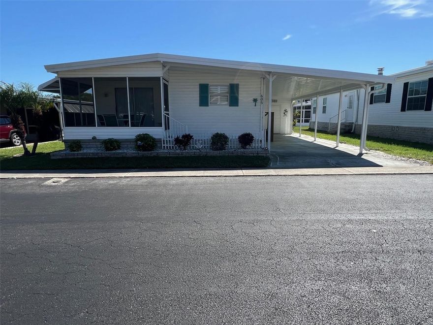 Discover the lifestyle waiting for you at Palm Hill Country Club, a welcoming 55+ community where comfort, recreation, and connection come together. Homebuyers are drawn to this community for its impressive range of amenities and the friendly atmosphere residents enjoy every day. The monthly maintenance fee of $554.00 includes water, sewer, garbage, lawn care, cable, and internet, making day-to-day living simple and predictable. Residents enjoy access to a wide variety of activities and facilities, including a 9-hole golf course, swimming pools, relaxing jacuzzis, spacious clubhouses, tennis courts, shuffleboard, billiards, a horseshoe pit, and a pickleball court. Now available is a well-located 2-bedroom, 2-bathroom home positioned directly across from the pool and clubhouse, putting some of the community’s most popular gathering spots just steps away! Whether you're looking for a year-round residence or the perfect seasonal getaway, this home offers the chance to enjoy an active Florida lifestyle.
INTERIOR:
Open the door to your move-in-ready, fully furnished home where a light-filled, welcoming atmosphere sets a positive tone from the start. Tasteful décor, plantation shutters, and  painted paneled walls blend seamlessly with laminate flooring that extends throughout much of the house. Central heat and air are in place, with ceiling ducts providing efficient distribution for comfortable temperature control throughout the home. The pleasant kitchen provides plenty of cabinetry and includes a compact desk—perfect for meal planning, managing bills, or writing shopping lists. Appliances such as a refrigerator, oven, and range are included, along with a broom closet for extra storage. Beside the kitchen is a charming dining area with a built-in corner hutch, adding character to this cozy gathering space, which opens directly onto a spacious living room ideal for relaxing and entertaining. A sliding door leads to the raised screened room, featuring tiled floors and a table with chairs, allowing you to comfortably enjoy the outdoors. The generous guest bathroom offers a large vanity with significant under-sink storage, extra cupboards, vinyl flooring, and a tub/shower combination. The guest bedroom is cleverly set up with two beds for visitors and a sizable closet with bifold doors. The primary bedroom, painted in calming coastal tones, feels like your own private sanctuary with its large walk-in closet and en suite bath that includes a walk-in shower with a glass enclosure. Settle in, unwind, and let your stress melt away!
EXTERIOR:
“Spectacular curb appeal” will likely be your first words upon seeing this eye-catching new listing. Crisp white vinyl siding pairs beautifully with attractive landscaping and classic shutters framing the front window, creating a polished exterior presence. A brand-new two-car carport and recent roof-over (2025) provide modern upgrades and reliable protection, while the rear of the home offers extra space to move about comfortably. A sizeable shed supplies ample room for a washer and dryer, along with tools, bikes, and additional belongings. Priced at $83,000 including the share, this fantastic opportunity delivers exceptional value for anyone looking to own a wonderful residence at an attractive price!  Call soon to schedule your private showing!