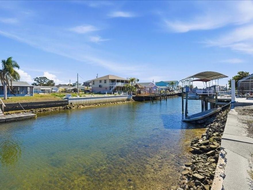 Your chance to build your dream home on this water lot 70 x 100 Sea Ranch Estates.  Boat docks and lift allowed, and canal access.  Quick boat ride to the gulf.  This land is conveniently located to Hudson Beach, great restaurants and shopping  and more.  Also golf cart community.