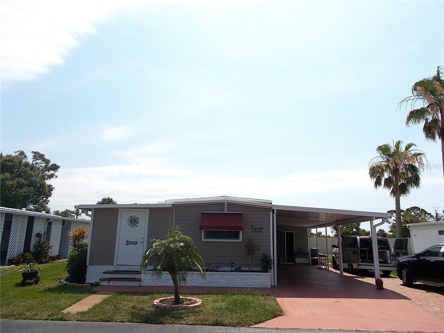 Come enjoy the good life in this updated mobile in Sandalwood Park!  This 2 bedroom/ 2 bath mobile home offers 1,000 square feet of living area with tons of updates, including but not limited to:  Brand new roof, new A/C, updated kitchen, updated bathrooms, newer laminate flooring throughout and fresh paint!  Love to cook?  Enjoy the kitchen island, wood cabinets and stainless appliances.  Is relaxation more your thing?  This mobile has a private "Zen Garden" with an outside shower, complete with artificial turf.  Sandalwood Park is in a fabulous location and your furry family members are welcome too!  Amenities abound and social gatherings are strong during the winter season.  Come meet your new friends at one of the friendliest and best managed mobile home communities in town and make this clean and updated home yours today!