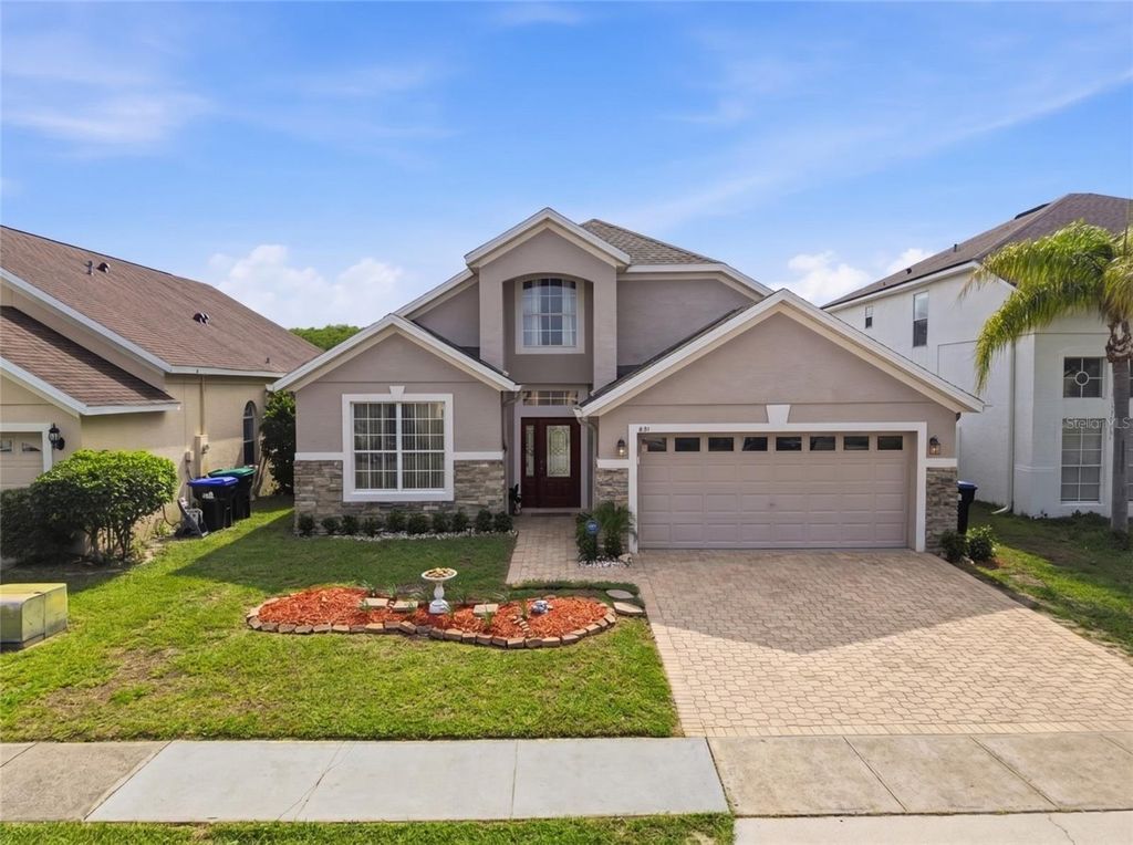 Photo of 831 Whispering Cypress Lane, Orlando, FL 32824 (MLS # O6414195)