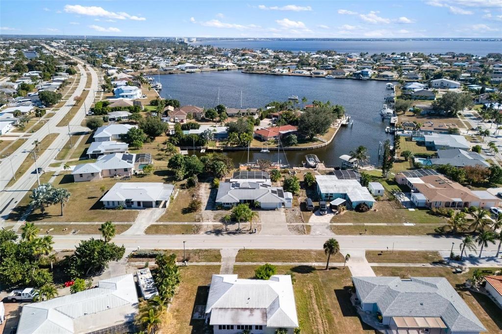 Photo of 105 Cousley Drive SE, Port Charlotte, FL 33952 (MLS # D6144973)