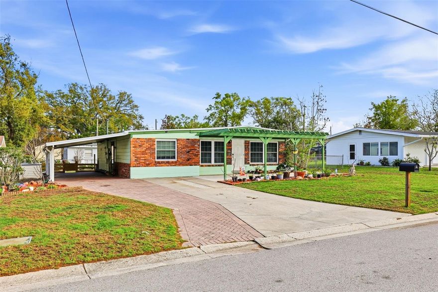 One or more photo(s) has been virtually staged. Welcome to this charming Move-In Ready Home in Carrollwood, Located in the desirable area between Dale Mabry and I-275, this beautifully updated home is perfect for first-time buyers or anyone seeking a truly move-in ready property. Conveniently situated close to  schools, popular restaurants, and a variety of shopping destinations, this home offers both comfort and accessibility. Inside, you’ll find brand-new luxury vinyl plank flooring and carpet throughout, along with freshly painted walls and ceilings that create a bright, clean feel. The home features high vaulted ceilings, adding to the spacious and airy atmosphere. The upgraded kitchen has been thoughtfully extended and includes custom cabinetry, brand-new appliances, and elegant granite countertops—perfect for cooking and entertaining. One bathroom has been fully renovated, while the second retains its original tile and tub in excellent condition, offering both charm and functionality. This home provides tons of storage throughout the property. Step outside to enjoy a large front patio, a two-vehicle carport, and a backyard shed for extra storage. Garden enthusiasts will love the raised garden beds ready for spring planting, as well as a stunning mature plumeria tree that produces beautiful blooms. The backyard also features a standout highlight: a mature avocado tree that produced over 50 Florida avocados in 2025! Additional perks include drought-resistant Bermuda grass in the front yard and peace of mind knowing the home is not located in a flood zone. Schedule your private tour today!!!