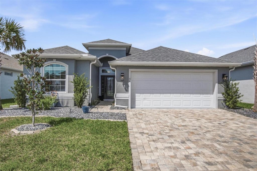 Photo of 34 Lagoon Way, Palm Coast, FL 32137 (MLS # FC316990)