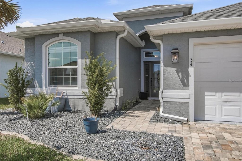 Photo of 34 Lagoon Way, Palm Coast, FL 32137 (MLS # FC316990)