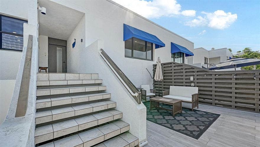 This stylish turnkey furnished beach retreat at Bayport Beach & Tennis Club is the perfect blend of classy with a modern flair. Before entering the home take note of the huge 16’ x 13’ outdoor deck where you can enjoy a partial view of the Gulf.  It's a great place to start your day with a cup of morning coffee, or enjoy a nice meal in the evening, and catch the spectacular colors of the sky as the sun sets!  Step inside to this inviting, beautifully appointed 2-bedroom 2-bath condominium with luxury vinyl flooring and crown molding throughout.  The entire living/ dining areas, lanai, both bedrooms and second bathroom have all been recently updated. Giving the condo a fresh polished appearance accentuated by recessed glass display shelving and an abundance of recessed lights.  The depth of workmanship in the updates carries onto the stylized door moldings into the primary bedroom.  All popcorn has been removed!  The kitchen offers a coffee bar, stainless steel appliances, a pantry, a nice arrangement of cabinets, and granite countertops open to the dining room and living room, perfect for entertaining. Take in the view of the lush tropical landscape and gorgeous pond right below the lanai that is open to the living room.  Perfect for a Murphy bed, extra living space, a reading nook or your second favorite spot for your morning coffee as the sun rises. The primary bedroom offers an additional 6’ by 6’ area that is perfect for an office desk looking out over nature.  The primary also offers a walk-in closet and a generously sized ensuite bath with dual vanities. Bayport Beach & Tennis Club is a gem with 27 tropical landscaped acres and 1200 feet of private Gulf waterfront deeded access.  Where you can grab a chair and umbrella and soak up the sun, or take in the breathtaking sunsets. Enjoy Sarasota Bay just outside your door and stroll to the private dock where you can fish, kayak, paddleboard, and watch for the manatees and dolphins as they cruise by. This community also offers a clubhouse, fitness center, 4 Har-Ter tennis courts, golf practice net, and a Junior-Olympic heated pool. Bayport Beach & Tennis Club consists of 17 buildings built between 1979 and 1983. Designed by architect Tim Seibert of the Sarasota School of Architecture. Located mid-key with a wealth of attractions moments away, including Bayfront Park, steps away, offering Pickle Ball, Basketball, Shuffleboard courts, playground, bike paths, kayak launch and Publix 2 miles away.
