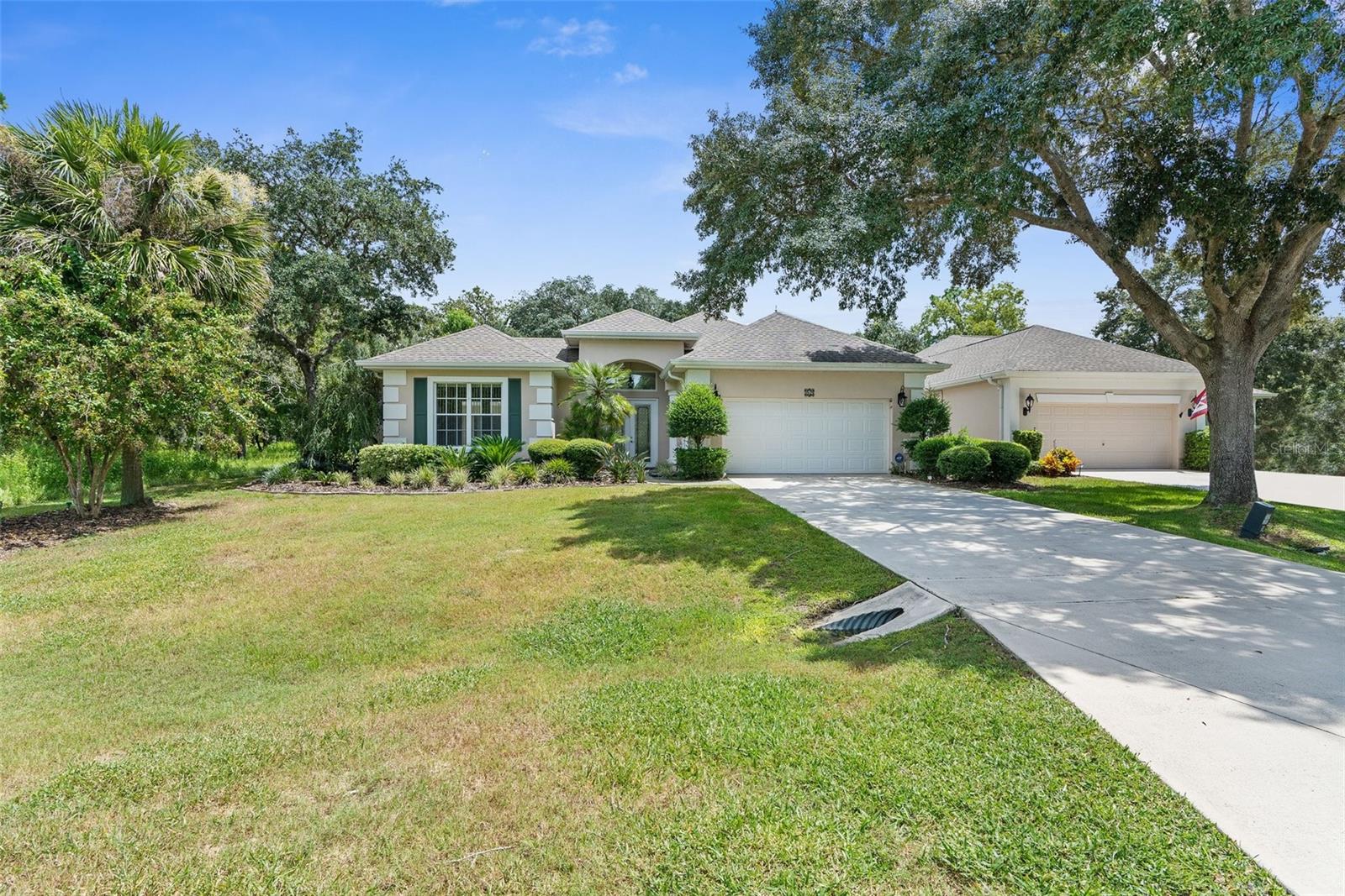 Florida Living at Its Finest! This beautifully maintained Courtyard Cabana-style home features 3 bedrooms, 3 full bathrooms, and a 2-car garage, all overlooking the 1st hole of Citrus National Golf Course in the desirable Cottages of Southern Woods in Sugarmill Woods. The main home offers 2 bedrooms, 2 bathrooms, a spacious kitchen, tray ceilings, inside laundry, and a screened lanai with golf course views. A separate third bedroom and bath across the private courtyard is perfect for guests, a home office, or in-law suite. Enjoy the screened-in pool with a waterfall feature, outdoor sink, and space for a grill—ideal for entertaining. The home also includes solar panels that significantly reduce utility costs (most recent bill was just $1.53!). Low-maintenance lifestyle with $840/year to Southern Woods HOA and $160/month to Cottages of Southern Woods, which covers lawn care, pest control, sprinkler maintenance, cable and internet. Additional upgrades: Roof (2019), HVAC (2016), Pool & waterfall (2012), Laminate flooring (2022), Fresh interior paint (2022), Private location with only one side neighbor and no front, rear, or right-side neighbors. No flood zone. Move-in ready! Quick access to US-19, Suncoast Parkway, and Crystal River.