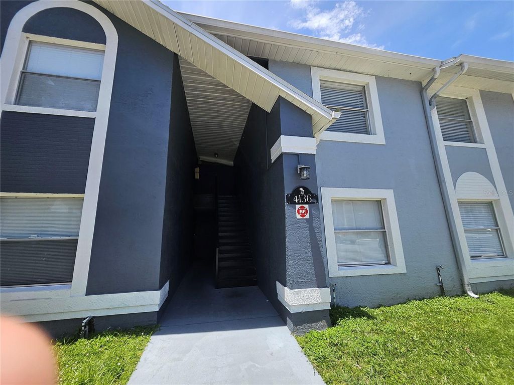 Photo of 4136 Pershing Pointe Place #4, Orlando, FL 32822 (MLS # O6416678)
