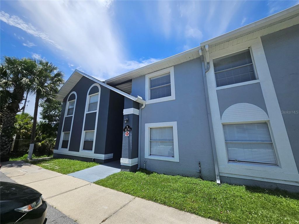 Photo of 4136 Pershing Pointe Place #4, Orlando, FL 32822 (MLS # O6416678)