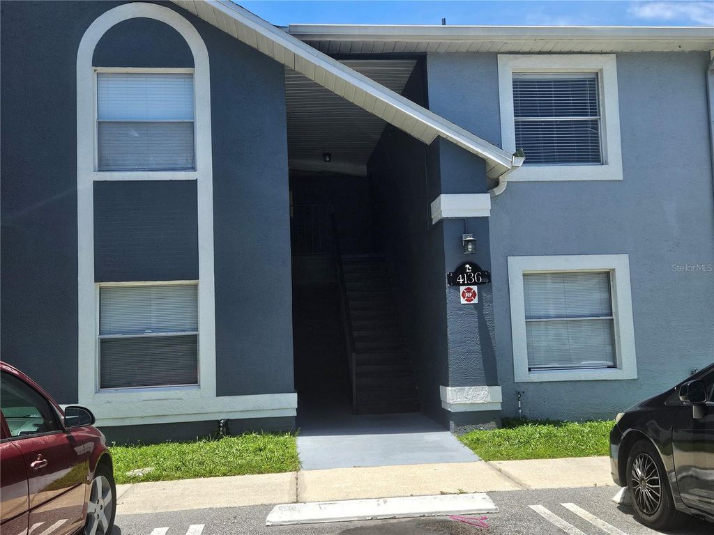 Photo of 4136 Pershing Pointe Place #4, Orlando, FL 32822 (MLS # O6416678)