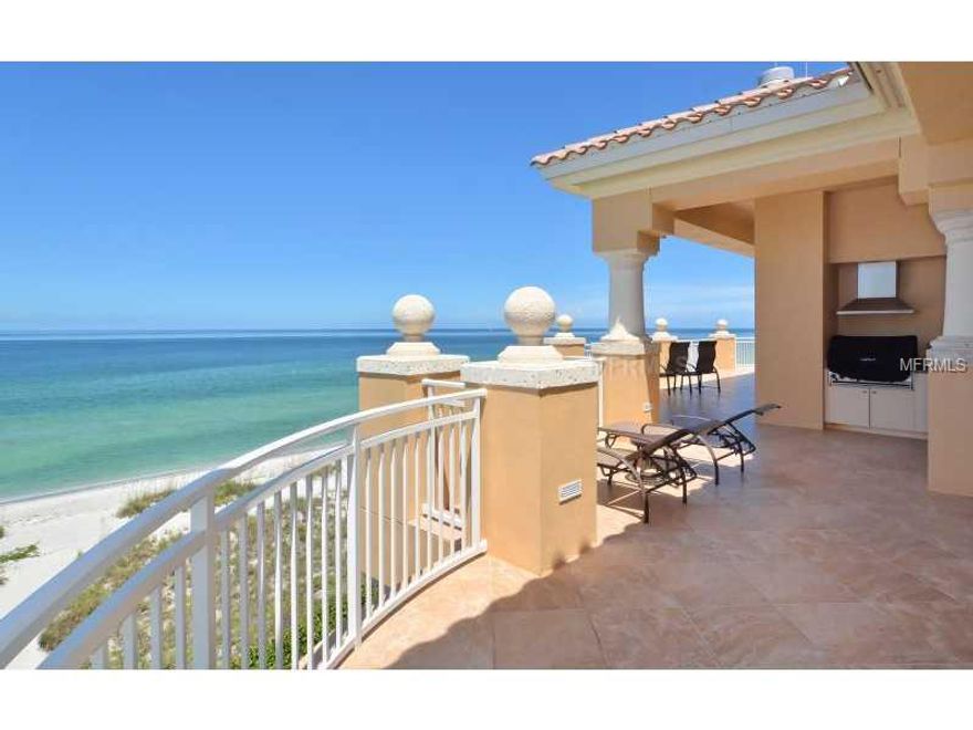 Direct Gulf front Penthouse with endless beach views and stunning sunsets from nearly every room. This 4,800+ sq. ft. residence lives like a single family home; in a quaint community comprised of only 10 residences, situated on 350' of Longboat Key's pristine beach. Take the elevator from your private three-car garage to the residence foyer where floor-to-ceiling walls of glass greet you. Wonderfully designed "transitional coastal" interior with an impressive living/dining room that features a custom trayceiling, statuesque columns and Travertine tile flooring throughout. The custom details continue into the spacious kitchen that overlooks the family room and breakfast nook. The kitchen is a chef's dream with Wolf stainless steel appliances, side-by-sideSub-zero refrigerator and freezer, solid Cherry wood cabinets, granite countertops, an extended island, breakfast bar and built-in planning desk. The split bedroom plan ensures privacy. The master suite is a definite retreat and includes its own foyer, wet bar and a private sitting room or study with its own terrace overlooking Sarasota's bay.  Plus, the spa-inspired bath ensures that you can relax the day away while your overnight guests enjoy the two guest suites with their own private terrace and den.An expansive wraparound Gulf front terrace, with direct access from nearly every room, also includes a summer kitchen with gas Wolf grill. La Firenza is a secure Gulf front community offering residents first-rate amenities.