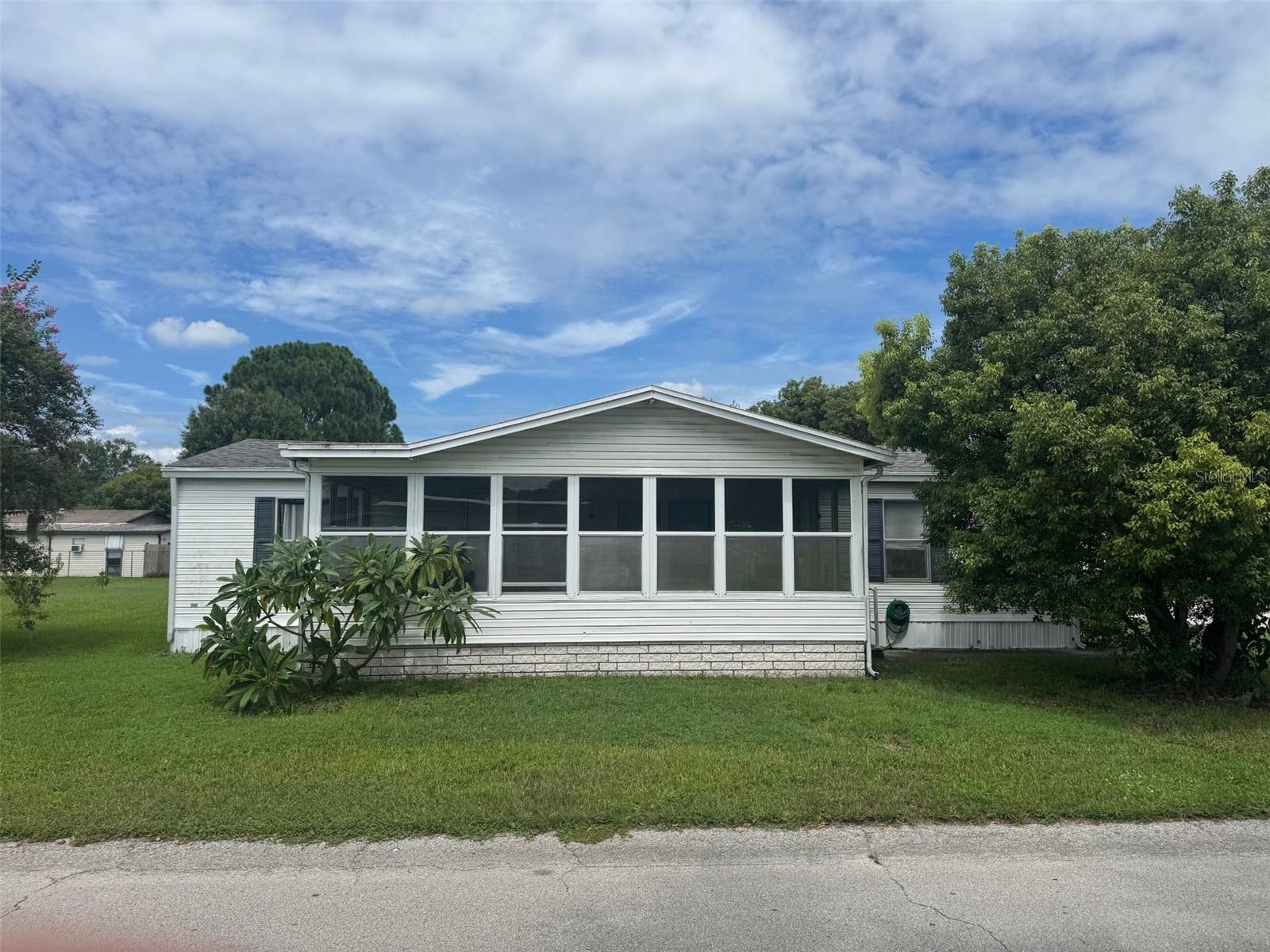 Welcome to 447 Oak Ridge W, a beautifully renovated and well maintained 3-bedroom, 2-bath manufactured home with many updates. the home sits on a corner lot with well maintained landscaping and foliage. Located in a quiet Lakeland neighborhood with no HOA, this home offers the ideal blend of comfort and convenience.