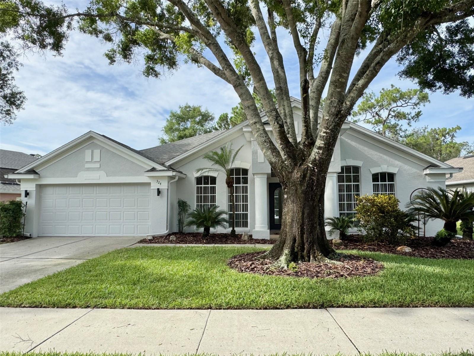 Welcome to your private Florida retreat. Nestled on a low traffic street with no rear neighbors, this beautifully maintained, one-owner home offers the ideal combination of privacy, comfort, and convenience. Step into a light-filled layout with soaring vaulted ceilings and immediate views of your screened-in pool and spa, set against a lush backdrop of peaceful nature. With fresh upgrades throughout and zoned for top-rated Seminole County schools, this home is perfect for anyone seeking tranquility without sacrificing location. Property Highlights: 4 spacious bedrooms/3 full bathrooms, 2,366 sq ft of living space, Split bedroom floor plan for added privacy, Master suite with dream walk-in closet, Ensuite bath with dual sinks, soaking tub & walk-in shower, Versatile front room perfect for a home office, Formal dining area with direct access to the kitchen, Large kitchen with ample cabinet storage and breakfast bar overlooking main living area, New hardwood floors in master, Fresh interior & exterior paint in modern, neutral tones, New lighting fixtures & hardware throughout, Updated sprinkler system and beautiful curb appeal with mature landscaping and a stunning oak tree, Screen-enclosed pool and spa with tranquil views—no rear neighbors, Two car garage, Located just minutes from shopping, dining, parks, and the brand-new Orlando Health Lake Mary hospital. As you arrive, the majestic oak tree and well-manicured landscaping offer a warm welcome with dappled shade and charming curb appeal. Inside, you’re greeted by soaring ceilings and a clear line of sight to the backyard oasis—a perfect first impression. To the right of the entry, a sunlit bonus room offers flexibility as a sitting area, office, or creative space. To the left, a formal dining room flows into a spacious kitchen, making hosting and everyday living seamless. Whether you’re entertaining poolside or enjoying the peaceful sounds of nature from the spa, this home offers the best of Florida living—move-in ready and built to last.
