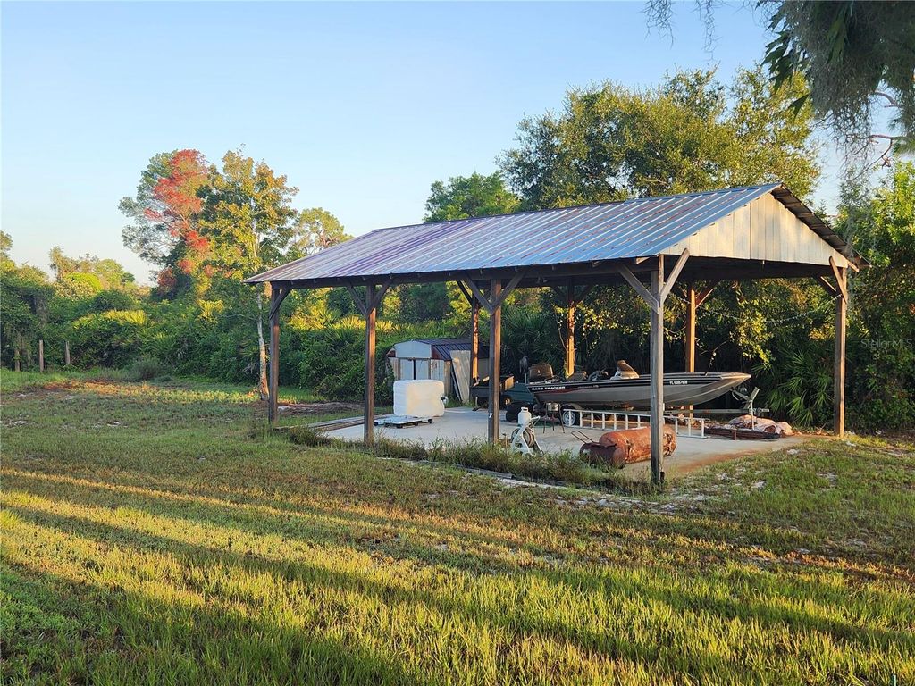 Photo of 144 Highlands Lake Drive, Lake Placid, FL 33852 (MLS # C7514167)