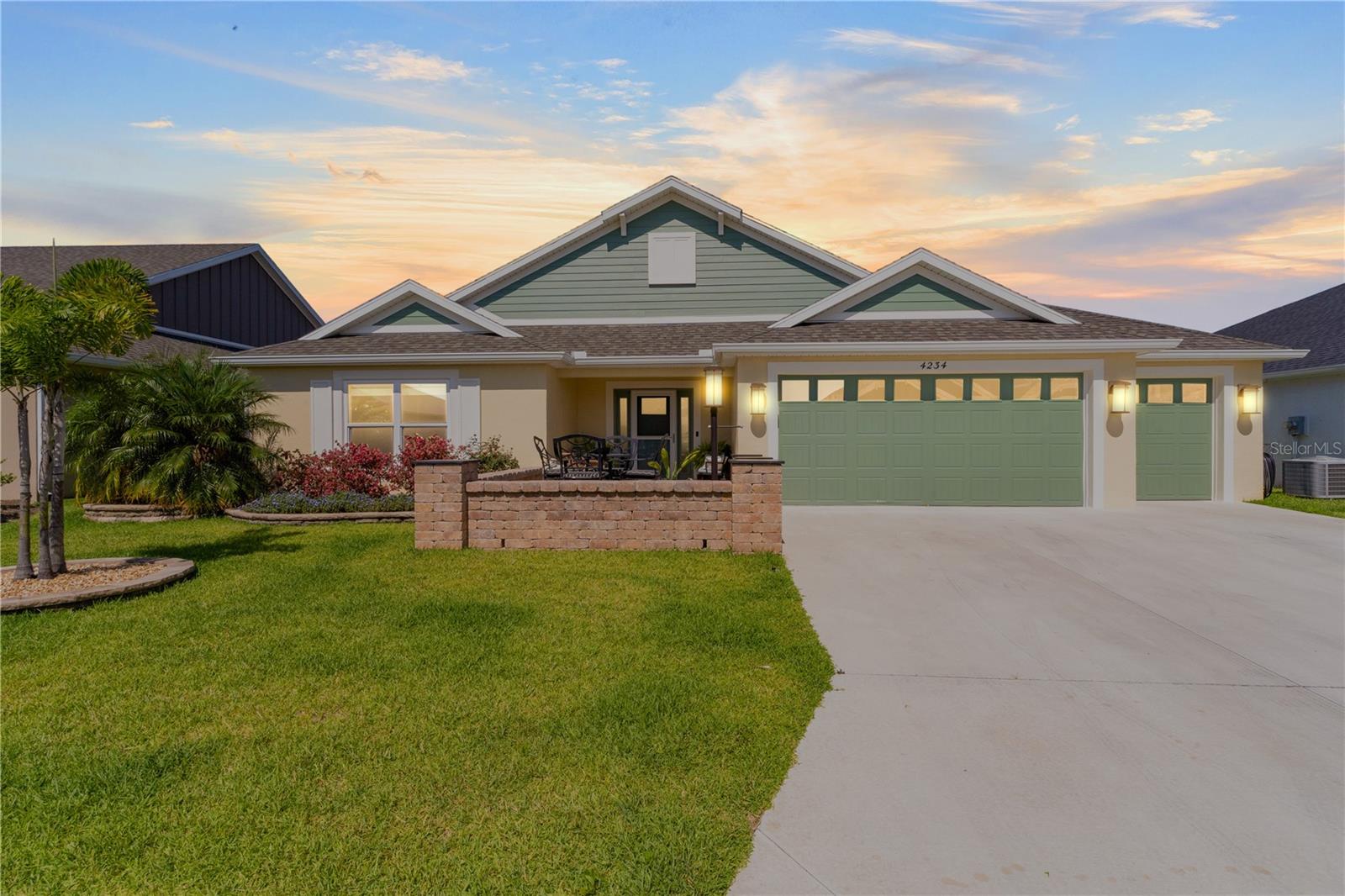 This Isabella Veranda (also known as the Songbird / Zinnia in the Designer Series) comes fully fenced with a privacy wall is located in the Village of Richmond, close to recreation, golf, and Brownwood Paddock Square. Inside the home, quartz counters are featured in both the kitchen and baths, along with a basket-weave tile backsplash. The layout includes two bedroom suites, each with a private bathroom and walk-in closet. The primary suite includes dual vanities, a roman shower, and a large walk-in closet. Crown molding runs throughout the entire home, which has been professionally painted in neutral colors. Additional updates include upgraded light fixtures and a whole-house water filtration system. Home is only 3 years old! Mechanicals maintained and serviced regularly.
The exterior features a paver courtyard with gated entry, professional landscaping, and a two-car plus golf cart garage. This home combines an updated interior with convenient access to recreation, golf, and entertainment.
The Richmond Recreation Center is only .3 miles away and offers an adult pool, shuffleboard, and both large and small dog parks. The Clarendon Recreation Center, with a family pool, is just .5 miles away. Within one mile you’ll also find the Lake Okahumpka Recreation Center, Richmond Pitch and Putt, and the new Harry and the Natives Restaurant. Brownwood Paddock Square is one mile away with shopping, restaurants, and nightly entertainment, just over the Brownwood Bridge on SR44. All major conveniences are at your finger tips! Access to I-75 and FL Turnpike are also only a few minutes away! Start living your retirement dream with everything you need just around the corner!