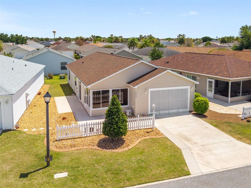 Village of St Charles/Hallandale Villas – Colony Patio Villa with VAULTED CEILINGS & Ceiling Fans! – BOND IS PAID!! – Roof 09/2024 – HVAC 08/2023 (with Ecobee Thermostat) - Electric Water Heater 10/2021 – Florida Room (Enclosed Front Lanai) with Vaulted Ceiling & Ceiling Fan - Pro Life WATER FILTRATION SYSTEM & SOFTENER - PLANTATION SHUTTERS - NO Carpet – Indoor Laundry (LG TROMM Washer & Dryer on Pedestals) – Bedroom 2 with Built-in Murphy Bed – Built-in Storage Shelving in Garage!! – This Villa has an Expanded Front and Side Patio Custom Painted & Textured, Rock Mulch in the Landscape Beds, Gutters & Downspouts, 2-Zone Irrigation with Rain Sensor – The Kitchen has an Indoor Laundry Closet, Pantry Closet, Breakfast Bar, Additional Lighting, Raised-Panel Cabinets with Crown Molding & Pull-out Shelves – Primary Bedroom with Walk-in Closet and En Suite Bath. Barn door entry to Bath, Step-in Shower with Solid Surface Walls & Corner Bench Seat with Shampoo Niche, Grab Bar, Rain Shower Head, Glass Panel – Bedroom 2 with Queen-size Built-in Murphy Bed, Ceiling Fan & Closet – Hall Linen Closet and Bath 2 with Tub/Shower Combo --  This Cute with its Bond Paid, and 2024 Roof, 2023 HVAC & 2021 Water Heater is s GEM that you don’t want to miss!.. check out the video on-line!