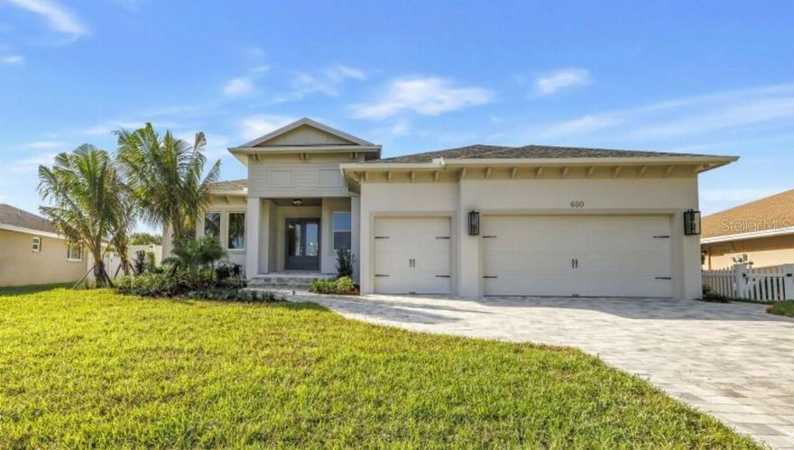 Don't miss the opportunity to live in one of St Petersburg's most sought after neighborhoods, Riviera Bay! This community's location offers quick and easy access to shopping, churches and synagogues, public and private schools, parks, and world class health care. Its location allows for easy, convenient accessibility to Tampa International Airport (TIA) and St. Pete International Airport (PIE), downtown St Petersburg and Gulf beaches, along with the City of Tampa and MacDill Air Force Base, 

This custom built, dream home, is constructed to a higher finished floor elevation than the most current flood code requirements. No homes in the neighborhood were flooded as a result of the recent hurricanes.

This custom home offers 4 bedrooms, 4 full bathrooms, and includes a luxury primary bedroom suite. Each bedroom offers a walk in closet. The gourmet kitchen features premium GE Cafe appliances and a great room, along with a large flex room give plenty of space for entertaining! A pool and heated spa with panoramic lake view and screened enclosure allow for family fun and relaxation! This home also includes a laundry room, 2.5 car garage, and expanded attic storage.  Additional highlights include  exquisite finishes, high impact windows, 10-11' ceiling heights, 8' doors, gas tankless water heater and digital thermostats with an integrated dehumidifying system.