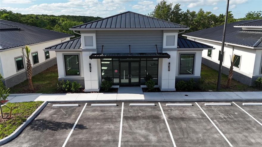 Under Construction. Building #11 is available for purchase at Lake Carter Exchange, a distinguished mixed-use development in Apopka’s East Shore at the intersection of Ocoee-Apopka Road and W Keene Road. This dark gray shell building is ideal for medical or professional offices, with potential for retail use based on buyer needs. The shell delivery offers full flexibility for custom interior design. The development is strategically located less than one mile from Advent Health’s seven-story, 120-bed hospital and opposite a new Publix Supermarket development. Situated in the vibrant East Shore trade area, which includes 5,000 planned residences and an average household income above $100k, this Class A property is perfectly positioned for businesses targeting growth in Central Florida’s second-fastest-growing city. Contact us for pricing details/incentives and to schedule a tour of this exceptional commercial opportunity.