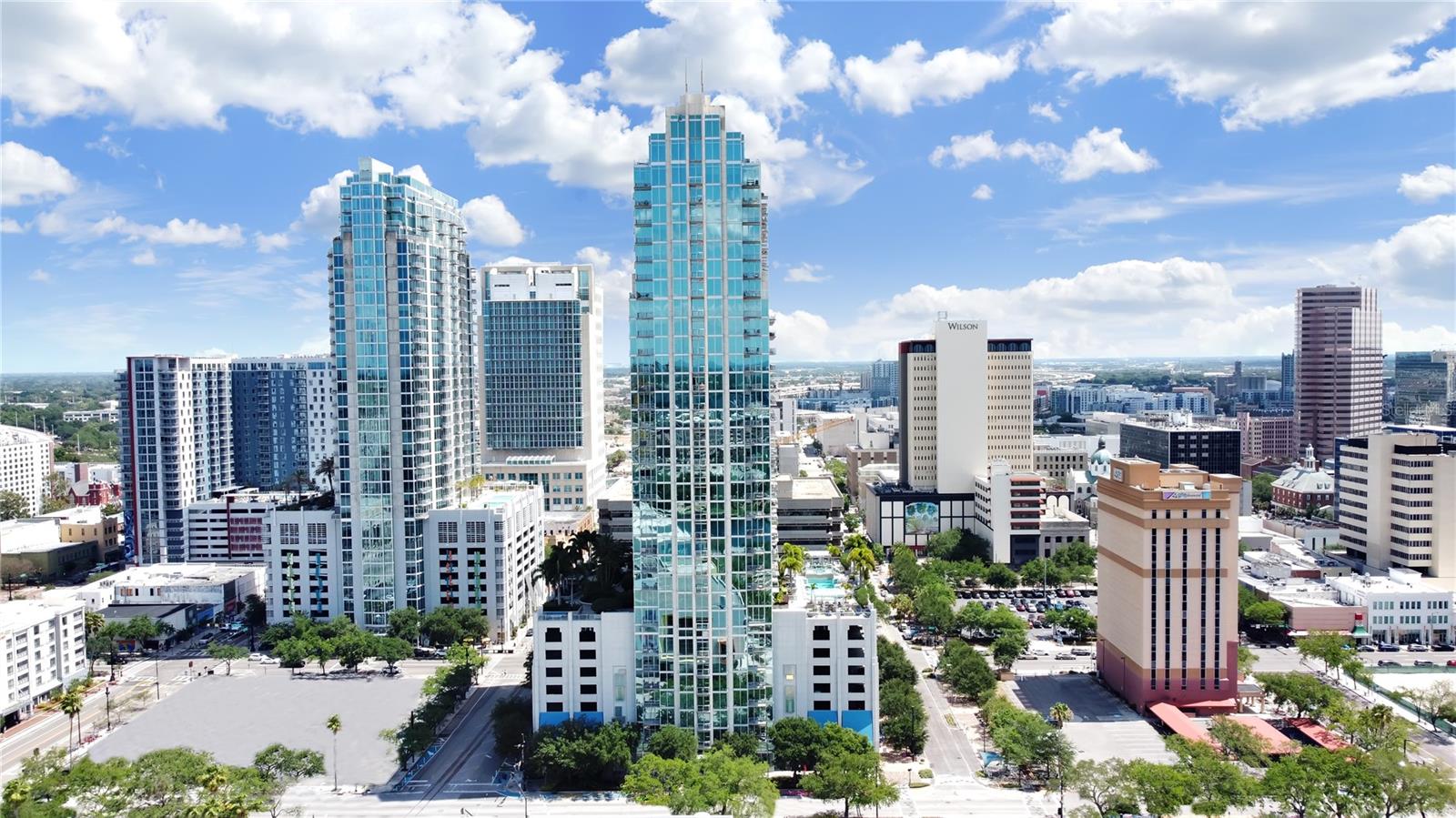 Located in one of the most modern buildings in Downtown Tampa this Skypoint 2 bed/2 bath residence puts the city at your feet. Floor-to-ceiling glass wraps the open living space, flooding it with natural light. The kitchen features sleek cabinetry, stone counters, and stainless appliances, flowing seamlessly into the dining and living areas—perfect for entertaining. The primary suite has a generous walk-in closet and spa-inspired bath, plus a well-sized second bedroom ideal for guests or a home office. Additional highlights include tall ceilings, in-unit laundry, a private balcony, and reserved garage parking with 2 spaces. SkyPoint delivers resort-style amenities with 24/7 concierge, fitness and lounge spaces, pool deck with grilling areas, and secure access. Step outside to the Riverwalk, Curtis Hixon Park, museums, acclaimed restaurants, and coffee spots—urban living at its best.