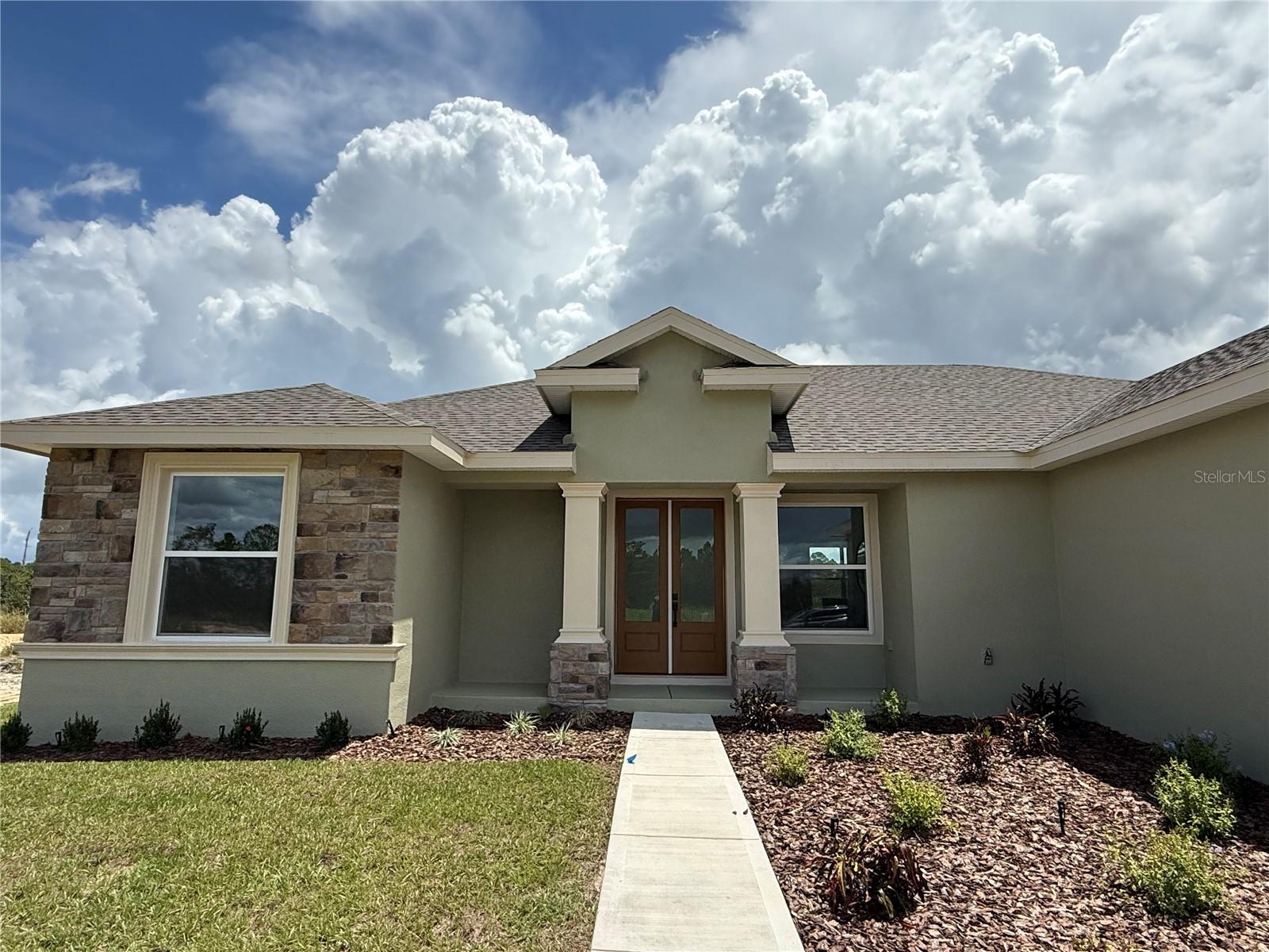 Beautiful brand new 4-bedroom, 3-bath home with a spacious 3-car garage, thoughtfully designed and loaded with upgrades. Features include solid surface countertops, luxury vinyl plank flooring, tiled showers to the ceiling, a large primary suite with a walk-in closet, soaring volume ceilings, and an open-concept floor plan. Enjoy outdoor living on the covered lanai. Located in the amenity-rich community of Sun N Lake Estates in Sebring, offering the perfect blend of comfort, style, and convenience.