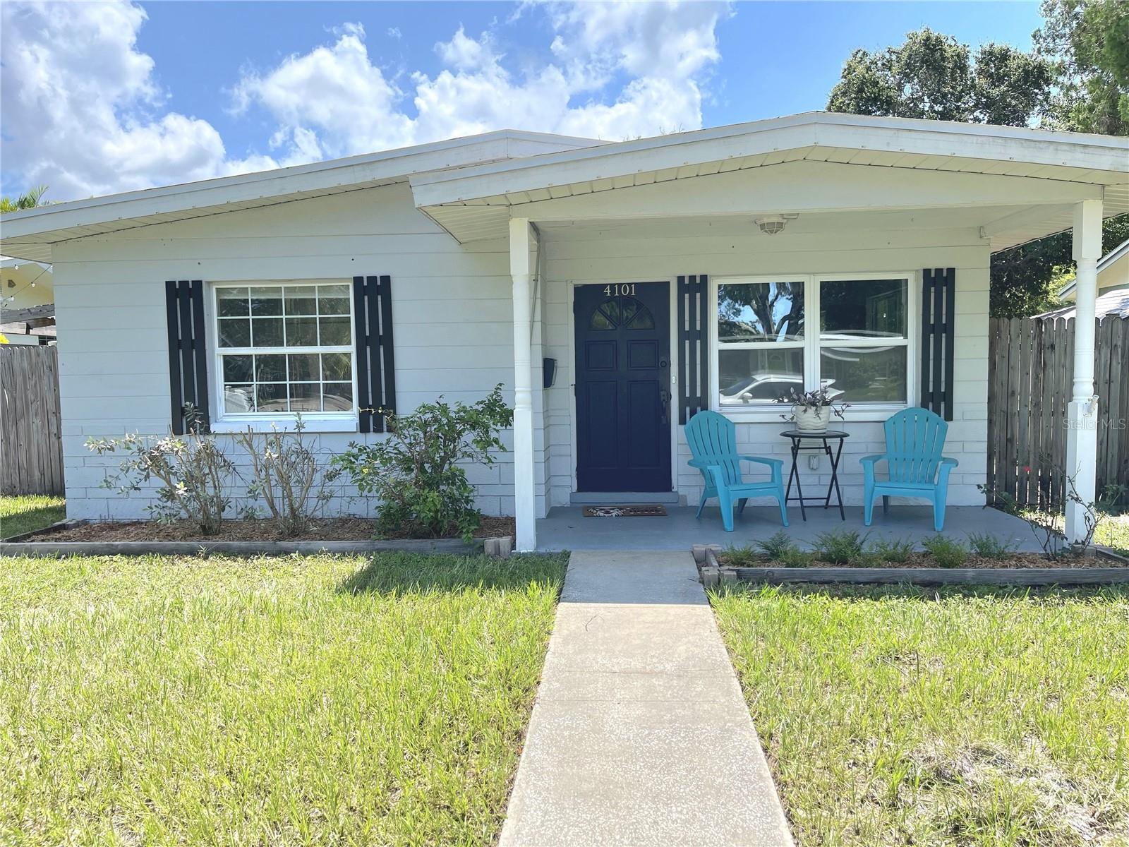 One or more photo(s) has been virtually staged. This well-maintained 2-bedroom, 1-bathroom bungalow, with a large backyard is designed for comfortable living. The open family room flows into the kitchen and connects to a versatile living-dining space. A connected workshop could serve as a future master suite or office. The fully fenced backyard, features a large shaded pergola for outdoor relaxation with front and rear access for boat or equipment storage. Parking is hassle-free with a clean rear alley and front on-street spaces for visitors. Recent updates include a 2023 kitchen, bathroom, flooring, and window remodel, a 2021 roof, and a 2020 AC, making this bungalow move in ready! A few blocks from the 38th St N and 275 ramp in St. Petersburg and a short distance to the Beach and shopping, this is a must see home that won't last long!!
