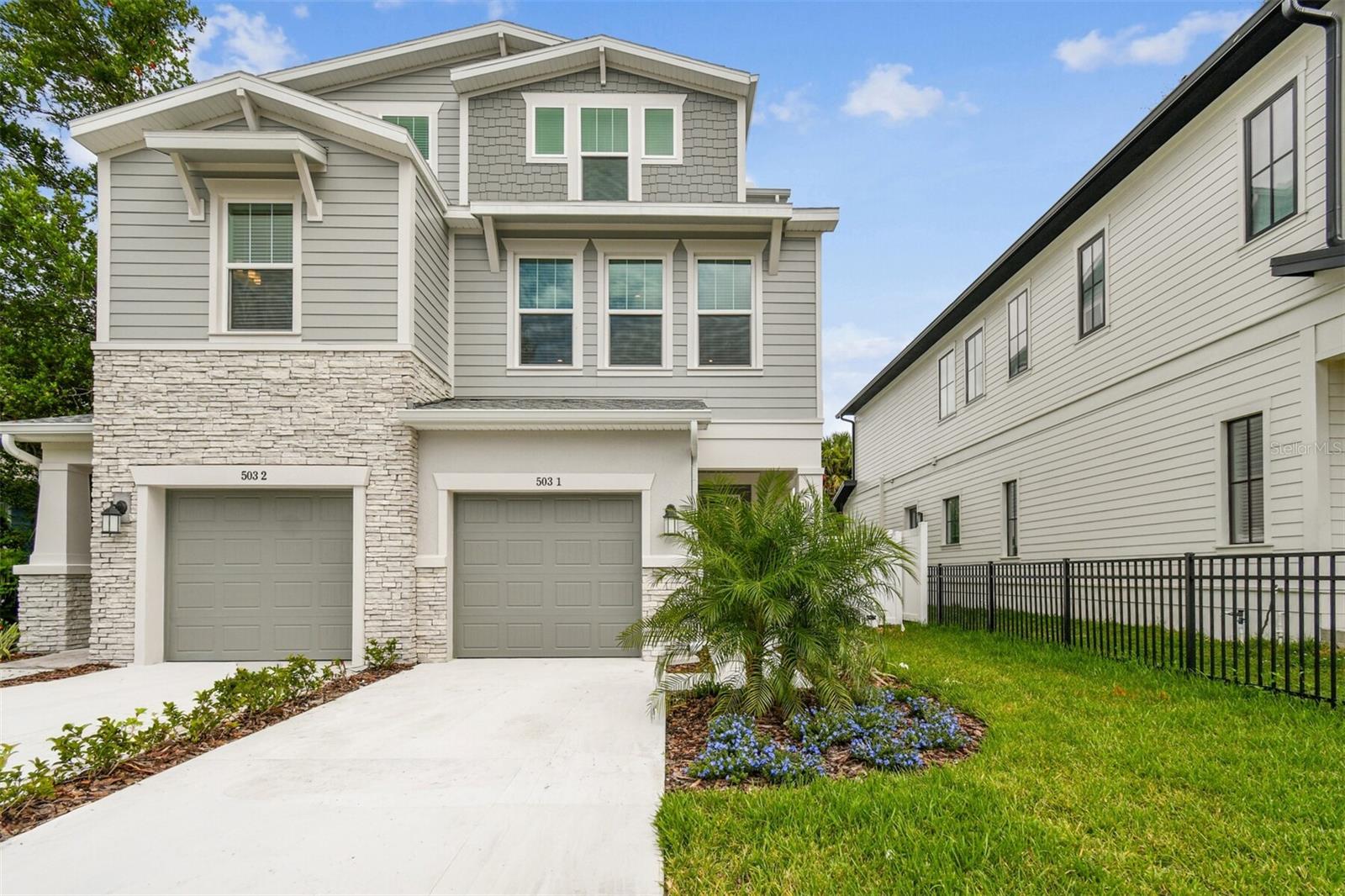 Under Construction. Welcome to this stunning, 3-story townhome in The Heights! Minutes to Armature Works, Riverwalk and don’t forget the brand-new Publix!
The exterior boasts tremendous curb appeal with a mix of Hardie plank siding, stucco, and stone detailing, setting the stage for the gorgeous interior. This fee-simple ownership townhome has no HOA fees, giving you more freedom and flexibility. Included is a 25ft deep, fenced in back yard to allow great outdoor living space. Inside, the design team has truly outdone themselves, blending natural maple tones with white and cream hues throughout. The standout kitchen is a dream with a large single bowl granite composite sink, herringbone backsplash, quartz countertops, and an open floor plan perfect for family gatherings.
The second floor features an oversized primary suite with 3 large windows that flood the room with natural light, a walk-in closet, and a convenient door leading directly to the laundry room. An additional en-suite on the opposite side of the floor offers privacy and comfort for guests or family members. Natural light fills the stairwells, which are adorned with oversized windows and sleek rev-wood laminate flooring that extends throughout the home.
The third floor is designed with versatility in mind, featuring 2 separate bedrooms, a bonus room, and a full bath—perfect for a home office, playroom, gym or guest space.
The home is backed by the trusted reputation of David Weekley Homes and a comprehensive builder's warranty, making it a smart, worry-free investment. We can’t wait to show it to you! Please note, photos and virtual tours are of a similar completed “Tanglewild” home for reference and may include options or features no longer available.