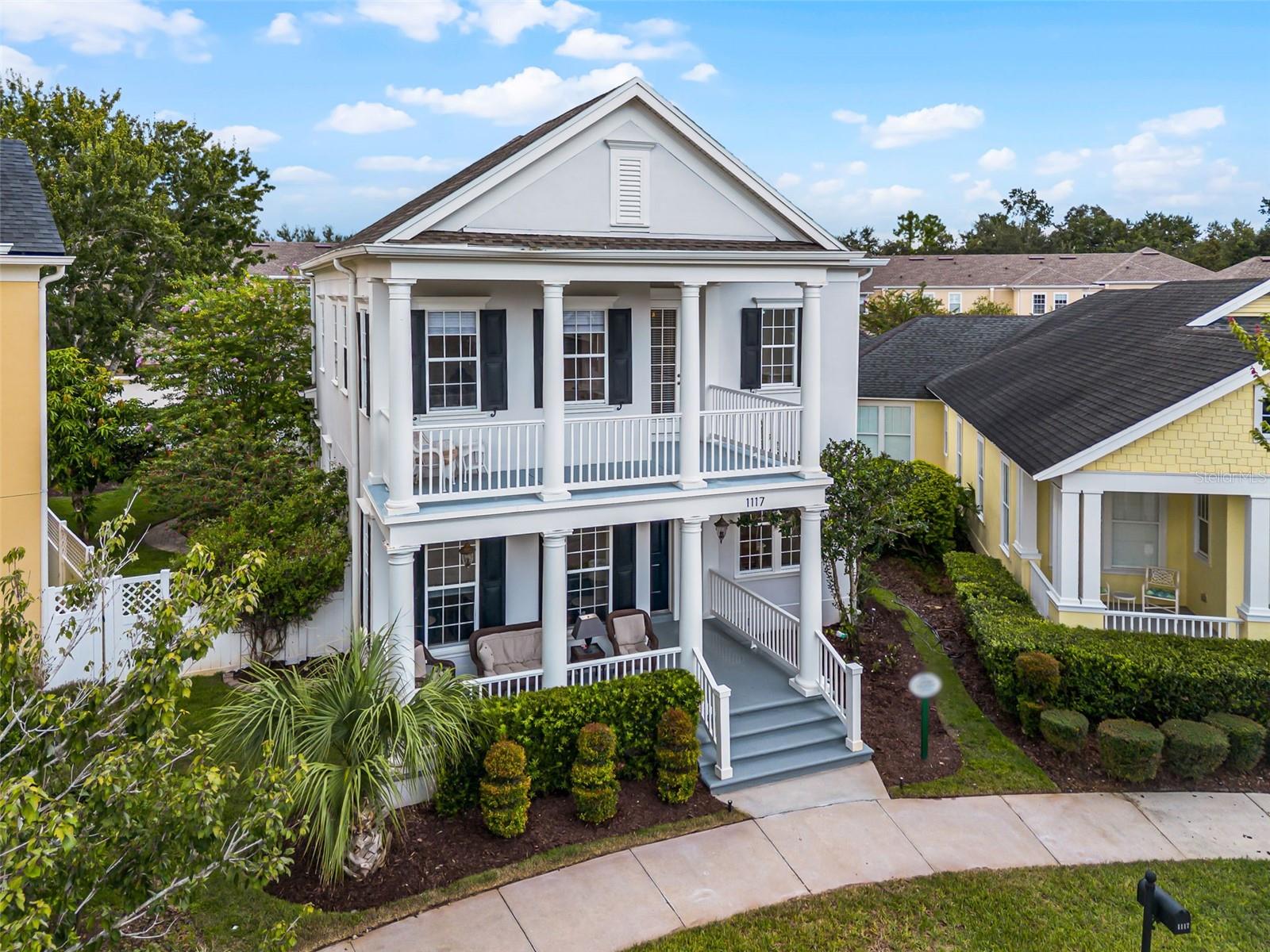 Welcome to this beautifully updated Lorin Classical model in the highly sought-after village of Artisan Park in Celebration, FL. This spacious residence features 4 bedrooms plus an office, combining timeless architecture with modern updates throughout. Set on an oversized pie-shaped lot, the home offers a large driveway and tranquil views of the front park. Relax outdoors on your screened back porch or the double front porches, perfect for soaking up the beauty and charm of Celebration. Inside, the home has undergone extensive upgrades including a new roof and new AC unit in 2022, a crown molding package, designer baseboards, full exterior paint, and a new landscape package in 2023, a dining room remodel and complete guest bathroom renovation in 2024, and in 2025 a new stairwell with custom railings and wood treads, removal of the knee wall, new carpet in all bedrooms, a fully remodeled master ensuite, extensive interior painting, and a new dishwasher. Living in Artisan Park means enjoying exclusive access to the Artisan Park Clubhouse with its full-service restaurant, state-of-the-art fitness center, meeting rooms, and heated resort-style pool and spa available to residents and their guests. Beyond Artisan Park, the award-winning community of Celebration offers 26 miles of walking and biking trails, scenic lakes, community pools, parks, and a charming downtown filled with dining, shopping, and year-round events. Easy access to major highways, Orlando International Airport, world class dining and shopping venues, and Orlando’s popular entertainment and theme parks.